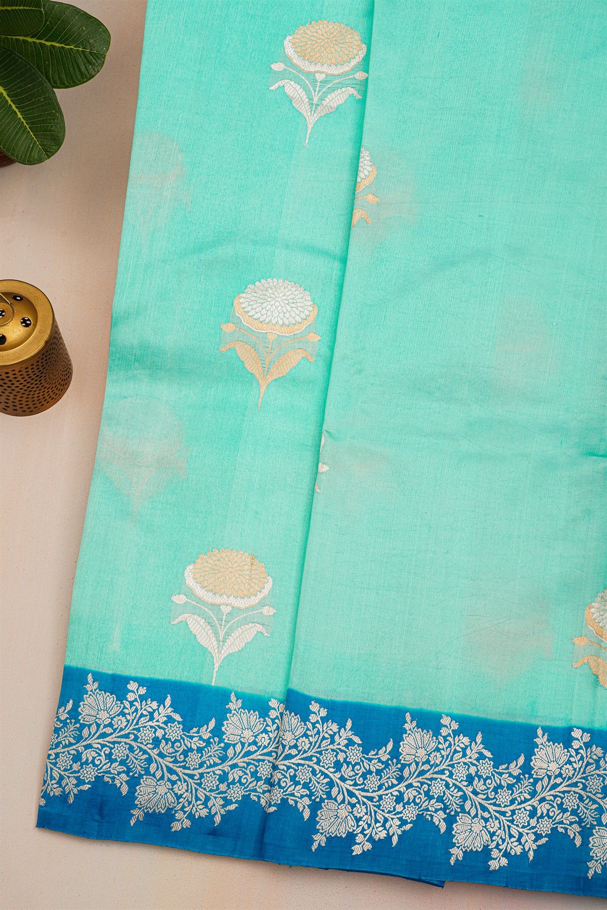 Fancy Matka Silk Sea Green Saree With Florals And Buttis Body And Contrast Florals And Leaves Border