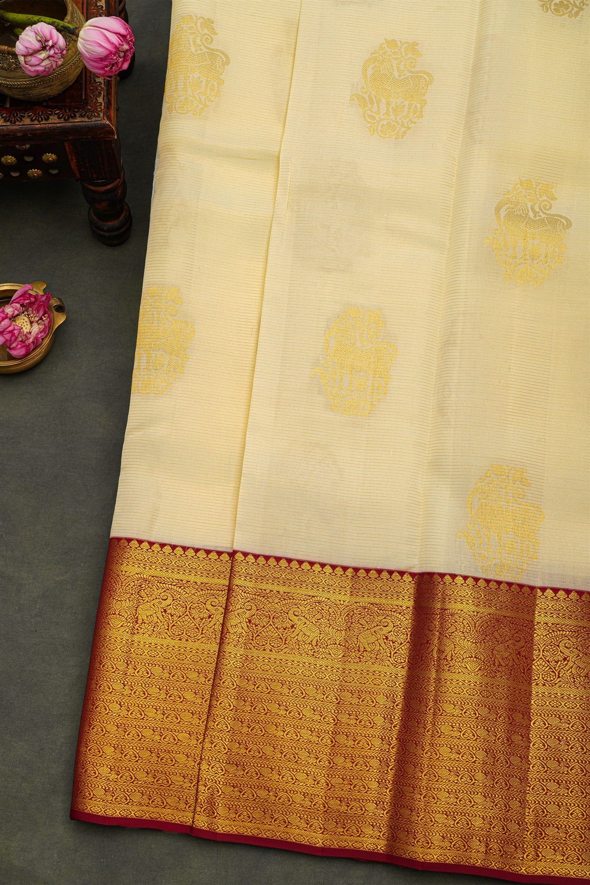 Kancheepuram Silk Cream Saree With Animal Buttis Body And Contrast Florals And Leaves With Animals Border