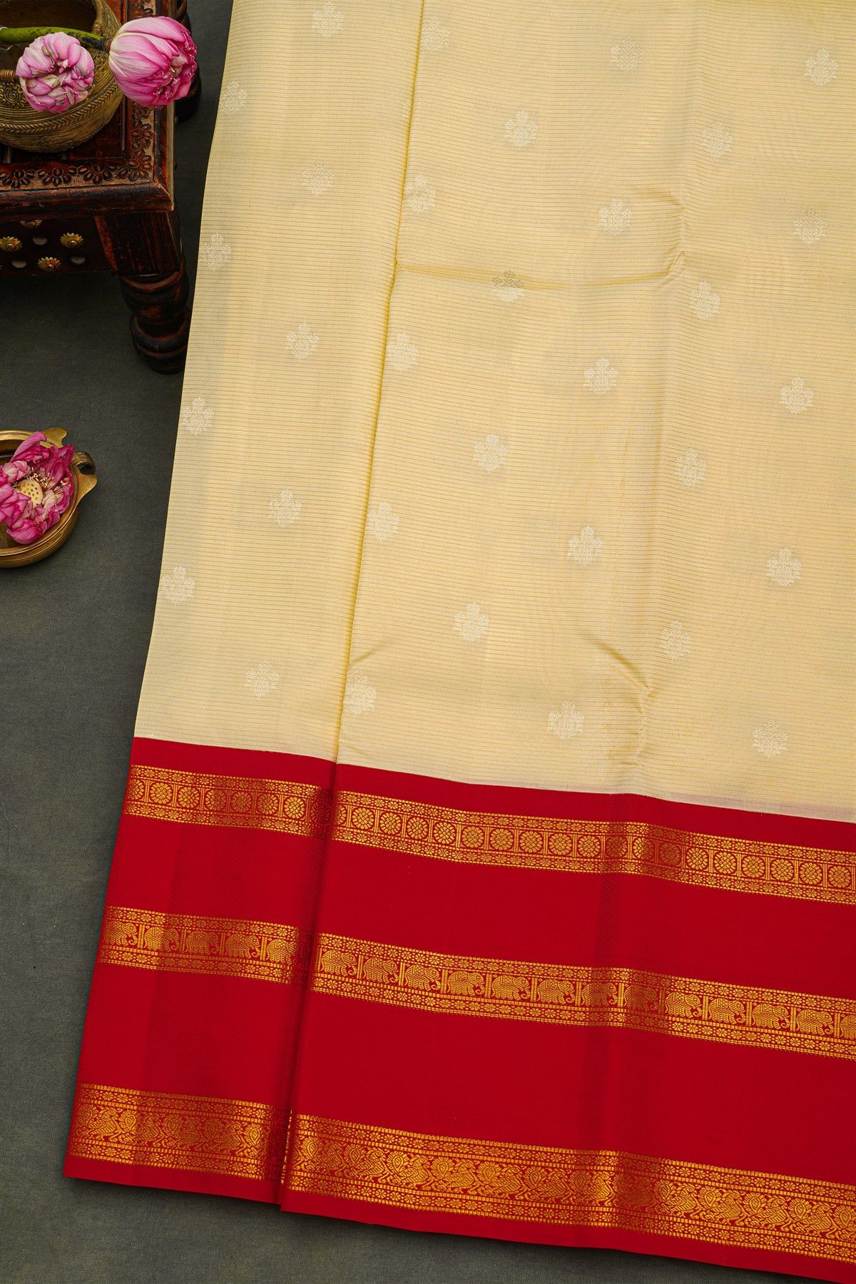Kancheepuram Silk Off White Saree With Florals And Buttis Body And Contrast Gap With Elephant Motifs Border