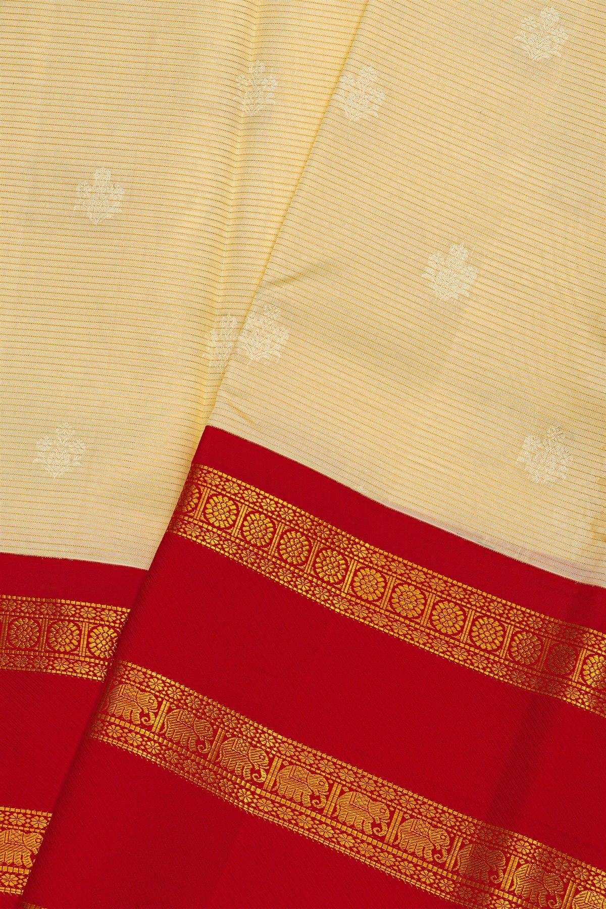 Kancheepuram Silk Off White Saree With Florals And Buttis Body And Contrast Gap With Elephant Motifs Border