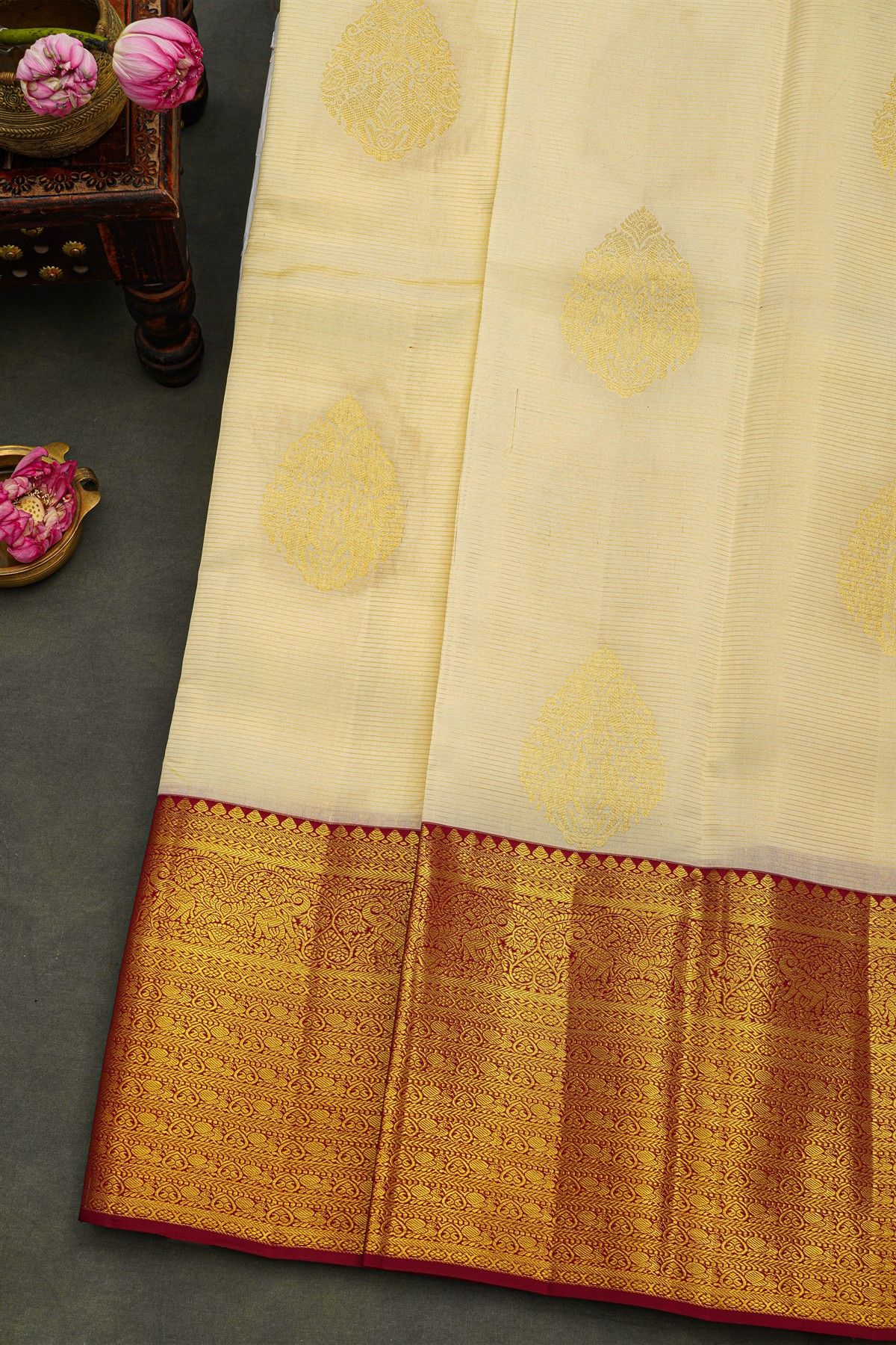 Kancheepuram Silk Off White Saree With Florals And Buttis Body And Contrast Florals And Leaves With Animals Border