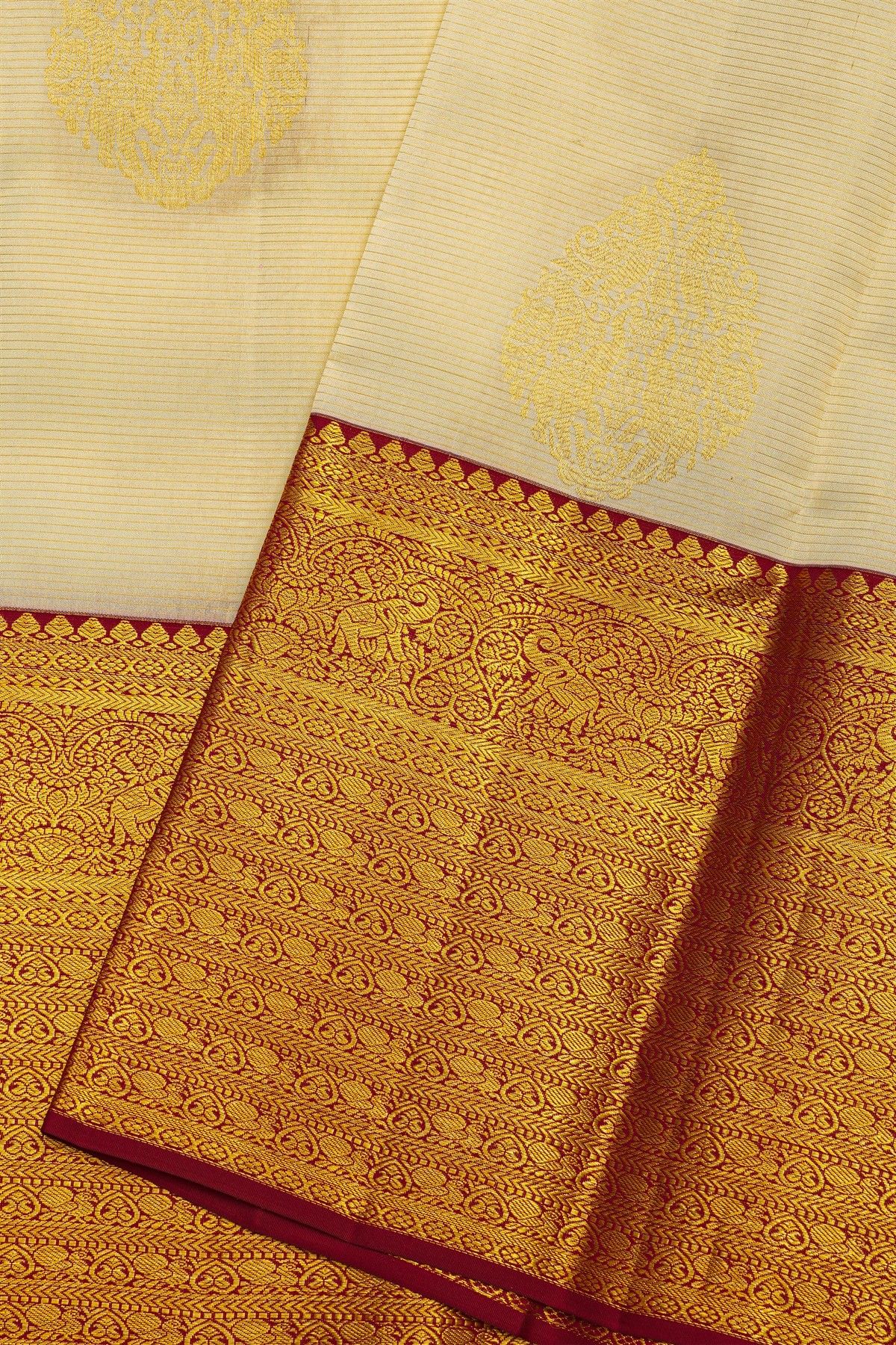 Kancheepuram Silk Off White Saree With Florals And Buttis Body And Contrast Florals And Leaves With Animals Border