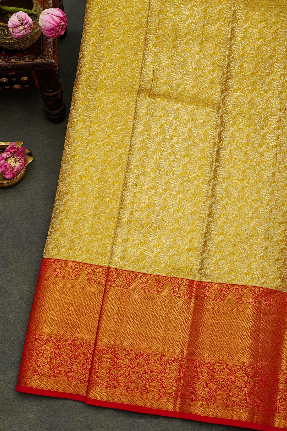 Kancheepuram Silk Gold Saree With Florals And Leaves Body And Contrast Zig-Zag Lines With Florals And Animals Border