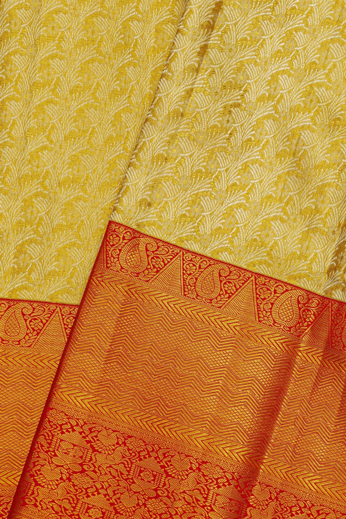 Kancheepuram Silk Gold Saree With Florals And Leaves Body And Contrast Zig-Zag Lines With Florals And Animals Border