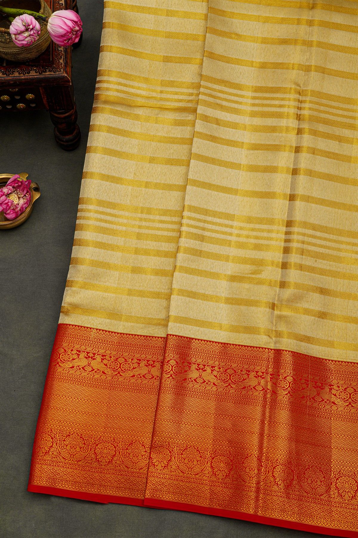 Kancheepuram Silk Golden Yellow Saree With Strips Body And Contrast Florals And Leaves With Peacocks Border