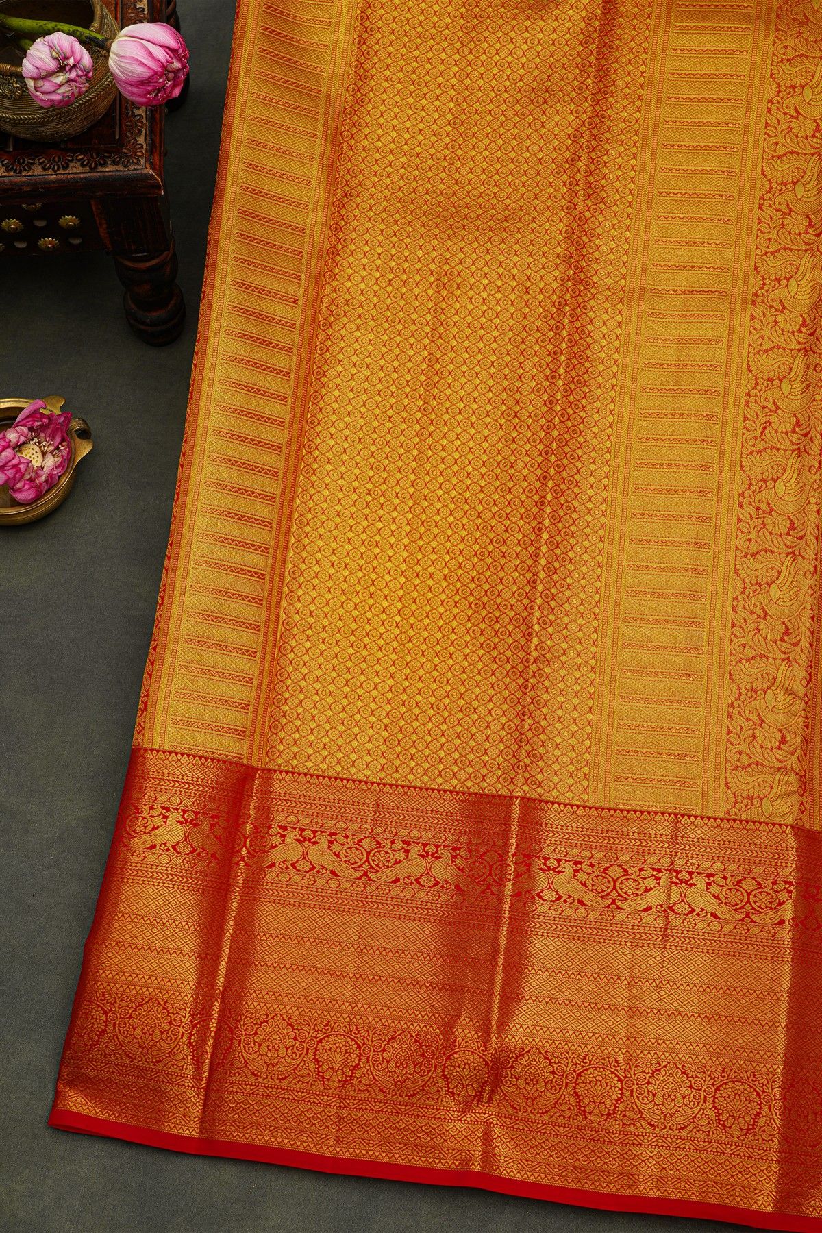 Kancheepuram Silk Golden Yellow Saree With Strips Body And Contrast Florals And Leaves With Peacocks Border