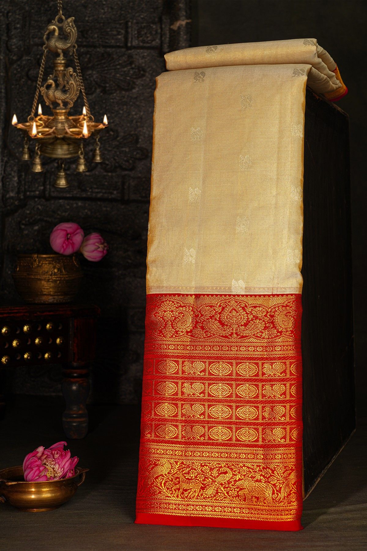 Kancheepuram Silk Cream Saree With Peacock Buttis Body And Contrast Florals And Leaves Border