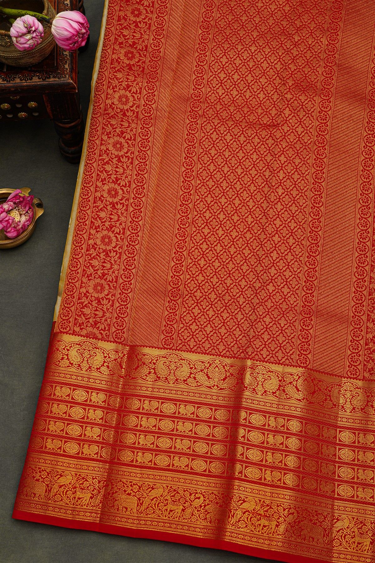 Kancheepuram Silk Cream Saree With Peacock Buttis Body And Contrast Florals And Leaves Border