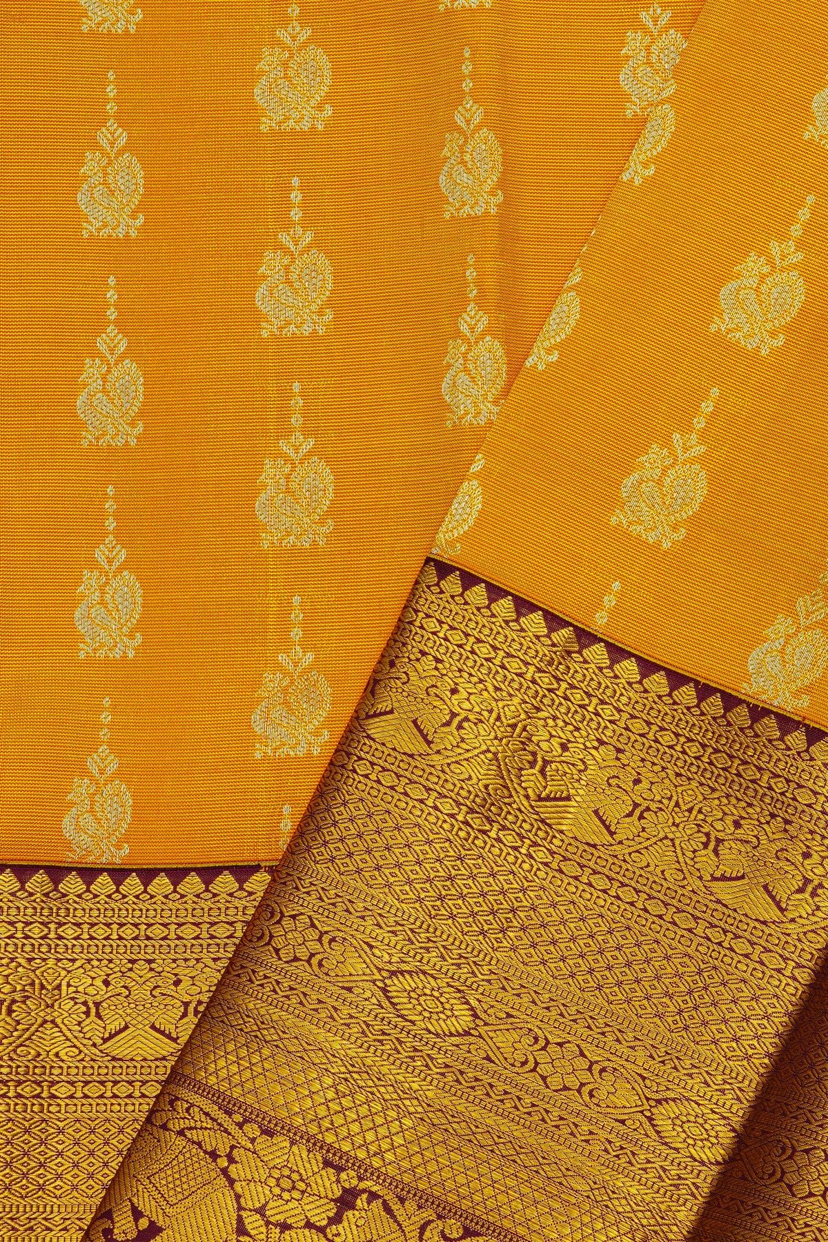 Kancheepuram Silk Yellow Saree With Peacock Buttis Body And Contrast Zari Diamonds, Florals And Animals Border
