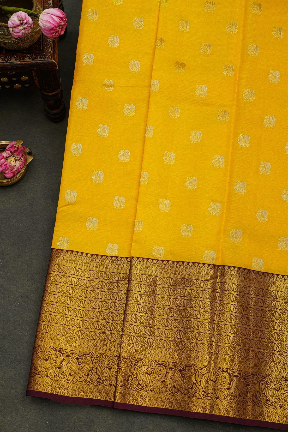 Kancheepuram Silk Yellow Saree With Peacock Buttis Body And Contrast Zari Diamonds, Florals And Animals Border