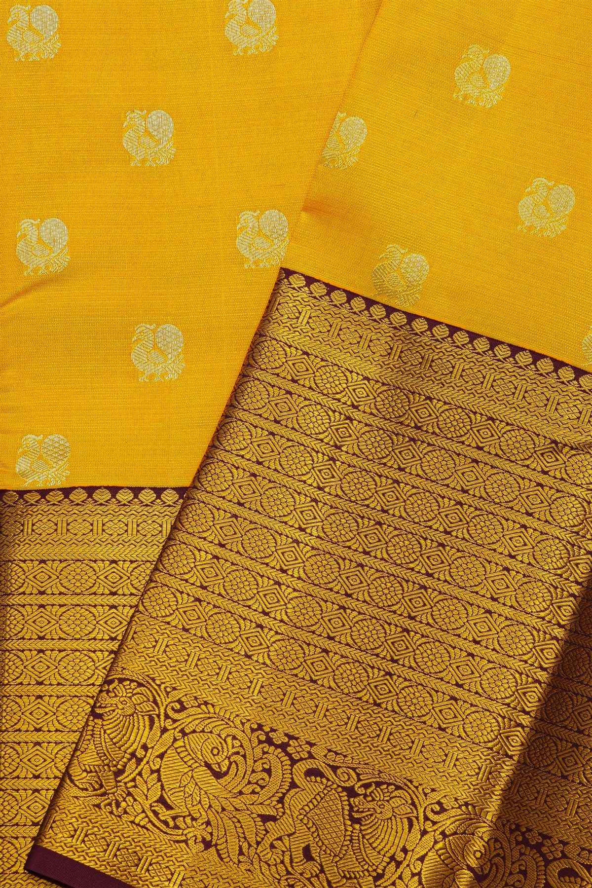 Kancheepuram Silk Yellow Saree With Peacock Buttis Body And Contrast Zari Diamonds, Florals And Animals Border