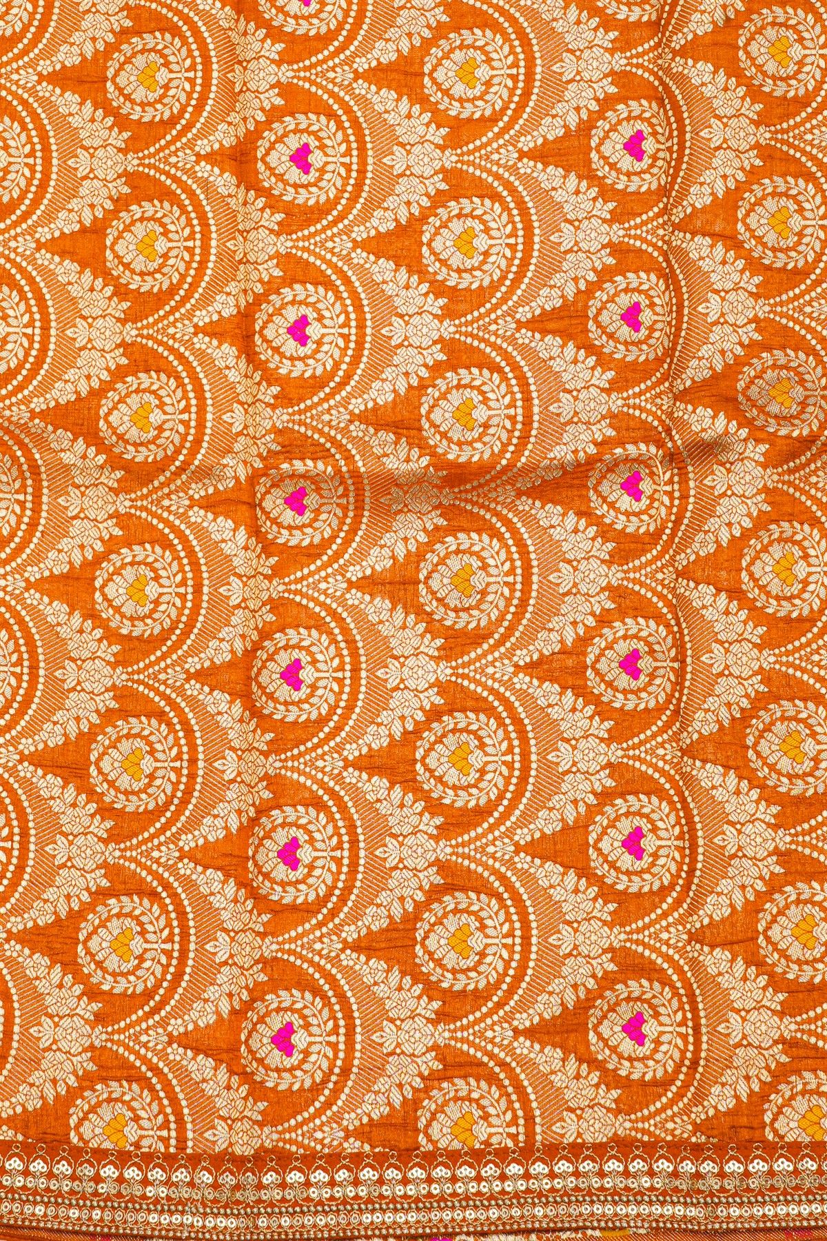 Fancy Crepe Orange Saree With All Over Plain Body And Self Design Florals And Leaves In Zari Border