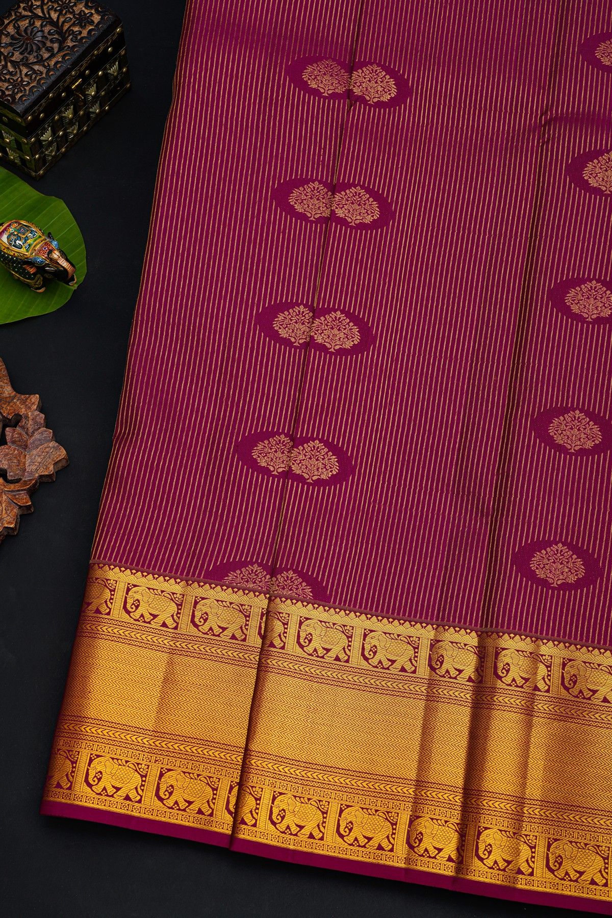 Kancheepuram Silk Magenta Saree With Florals And Leaves In Lines Self Border