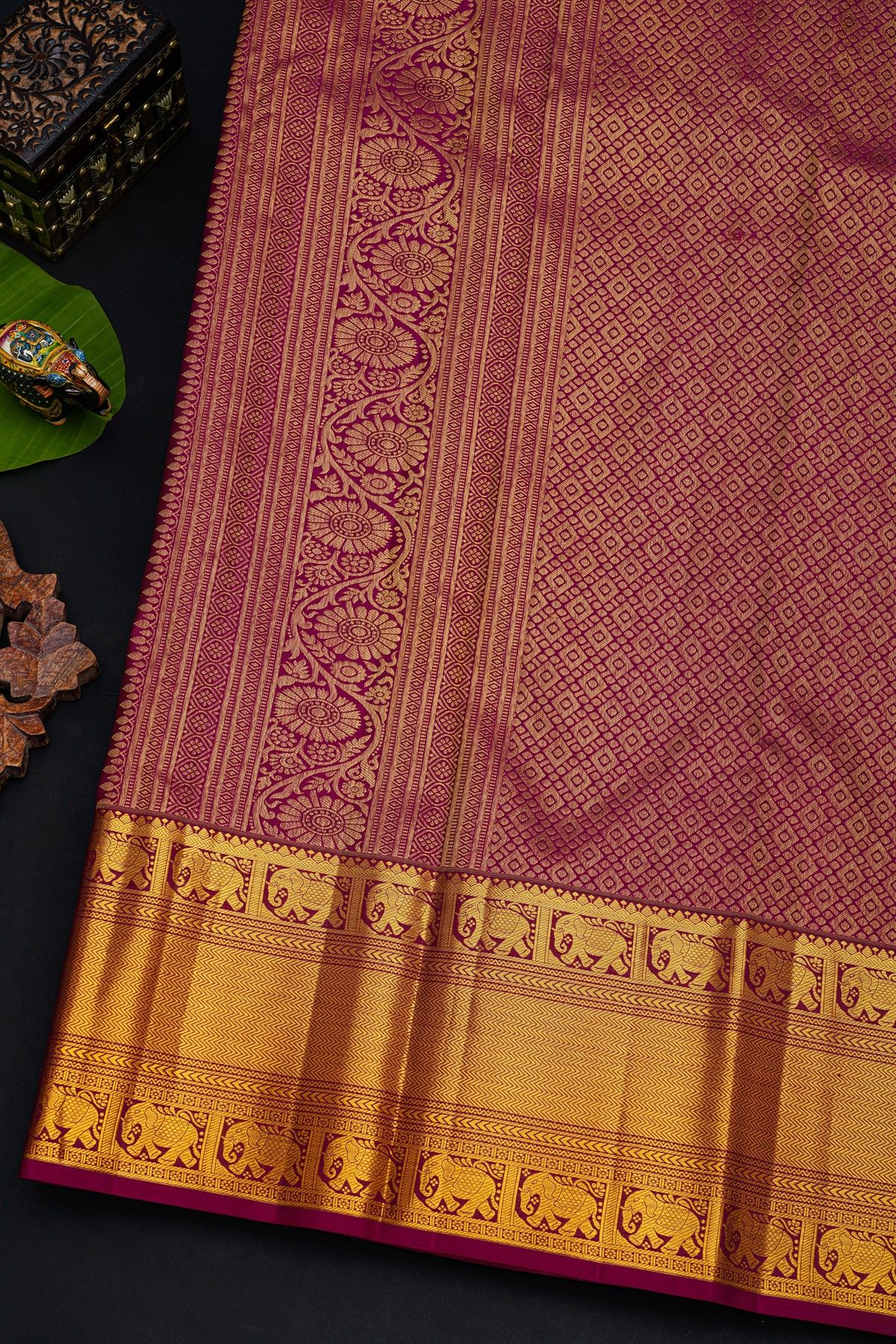 Kancheepuram Silk Magenta Saree With Florals And Leaves In Lines Self Border