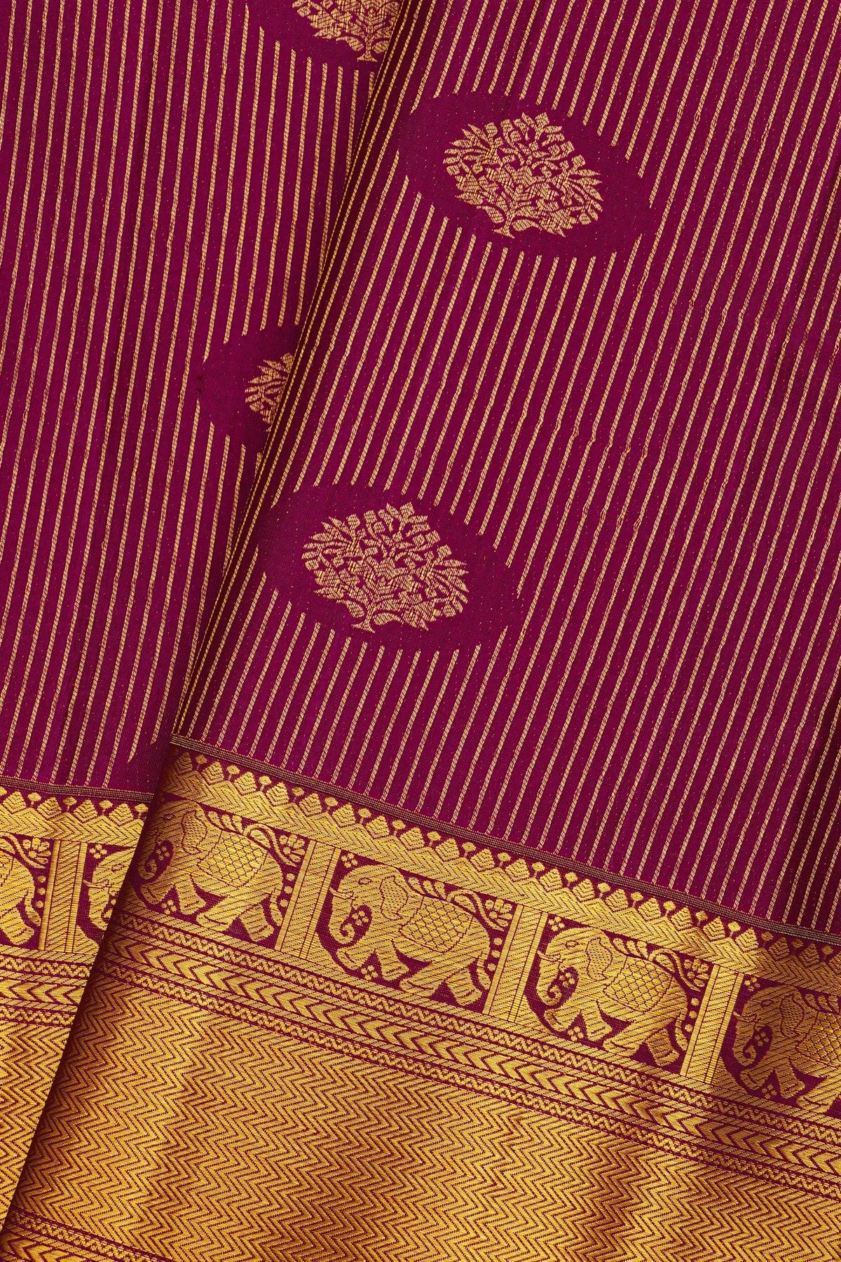 Kancheepuram Silk Magenta Saree With Florals And Leaves In Lines Self Border