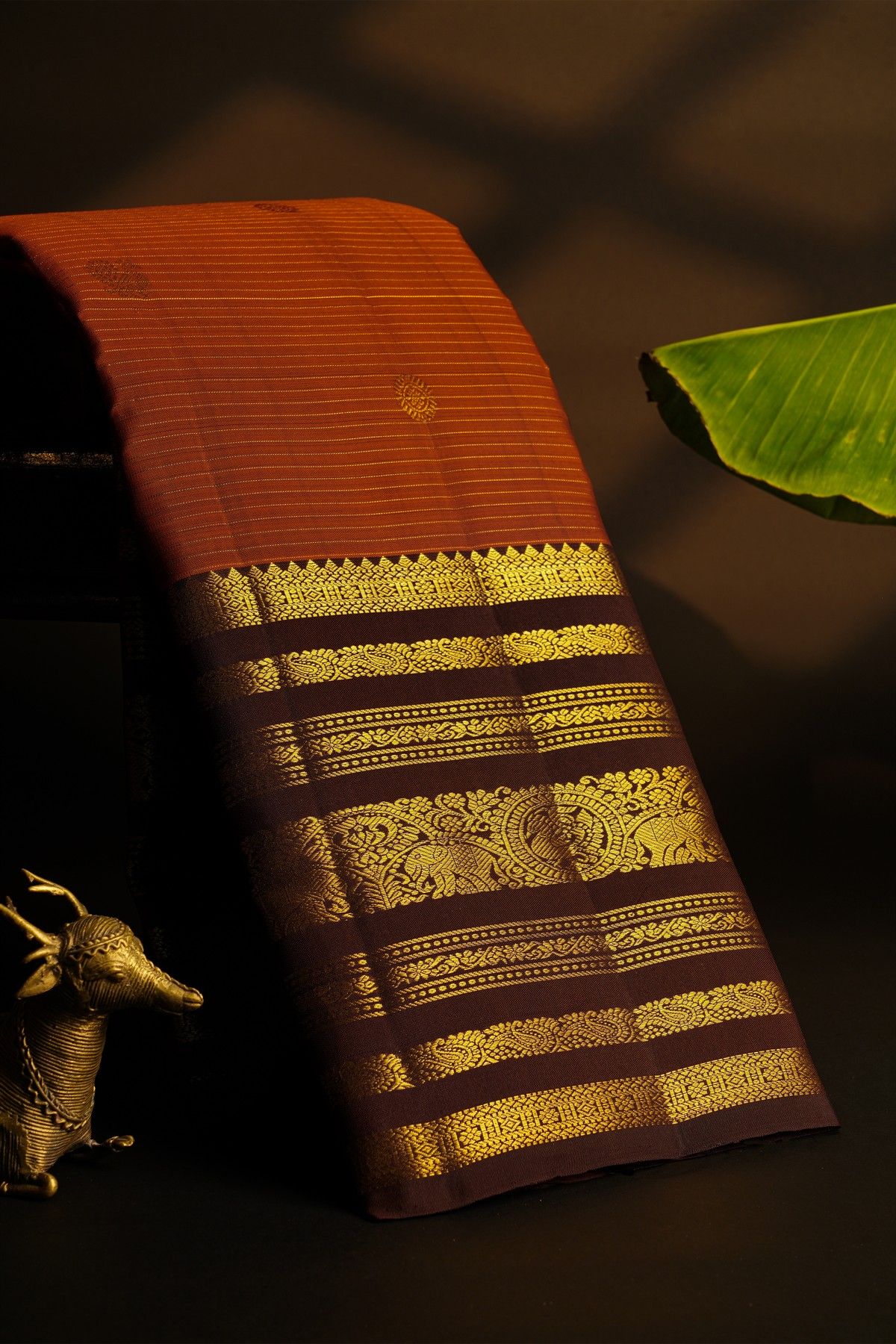 Kancheepuram Silk Rust Saree With Florals In Zari Lines Body And Contrast Traditional Border