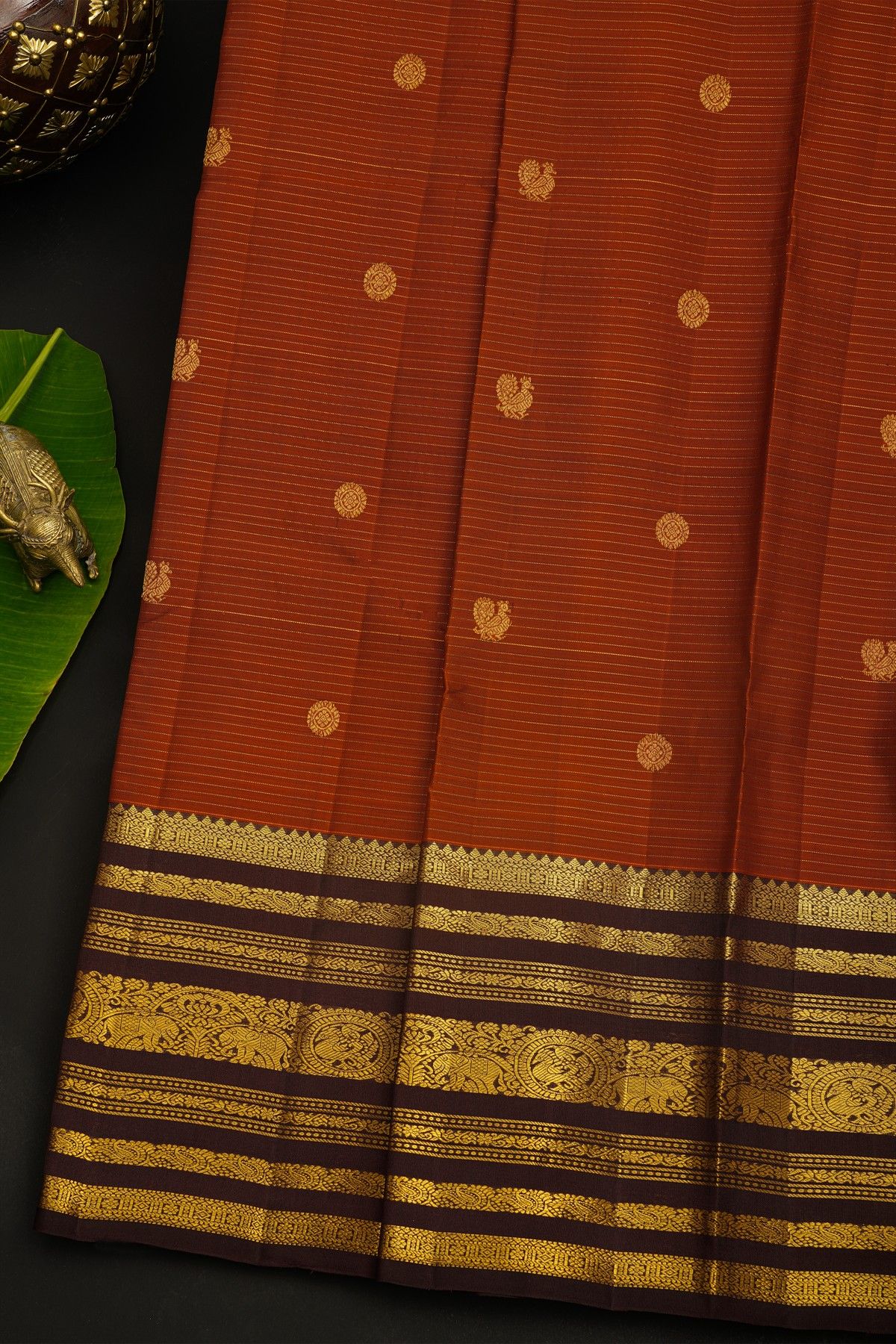 Kancheepuram Silk Rust Saree With Florals In Zari Lines Body And Contrast Traditional Border