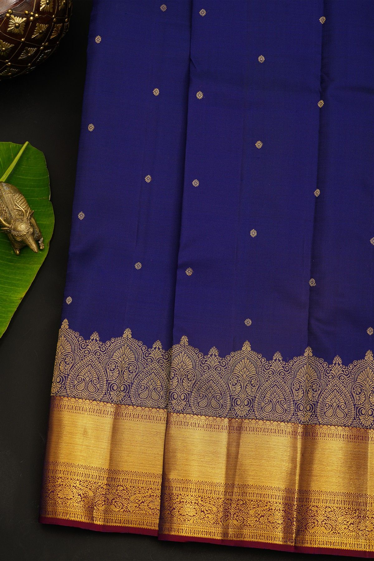 Kancheepuram Silk Blue Saree With Florals And Leaves In Zari Body And Contrast Florals And Leaves With Cross Lines Border