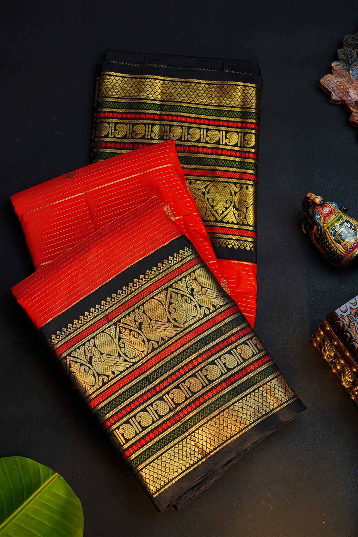 Kancheepuram Silk Orange Saree With Contrast Florals And Peacocks Border