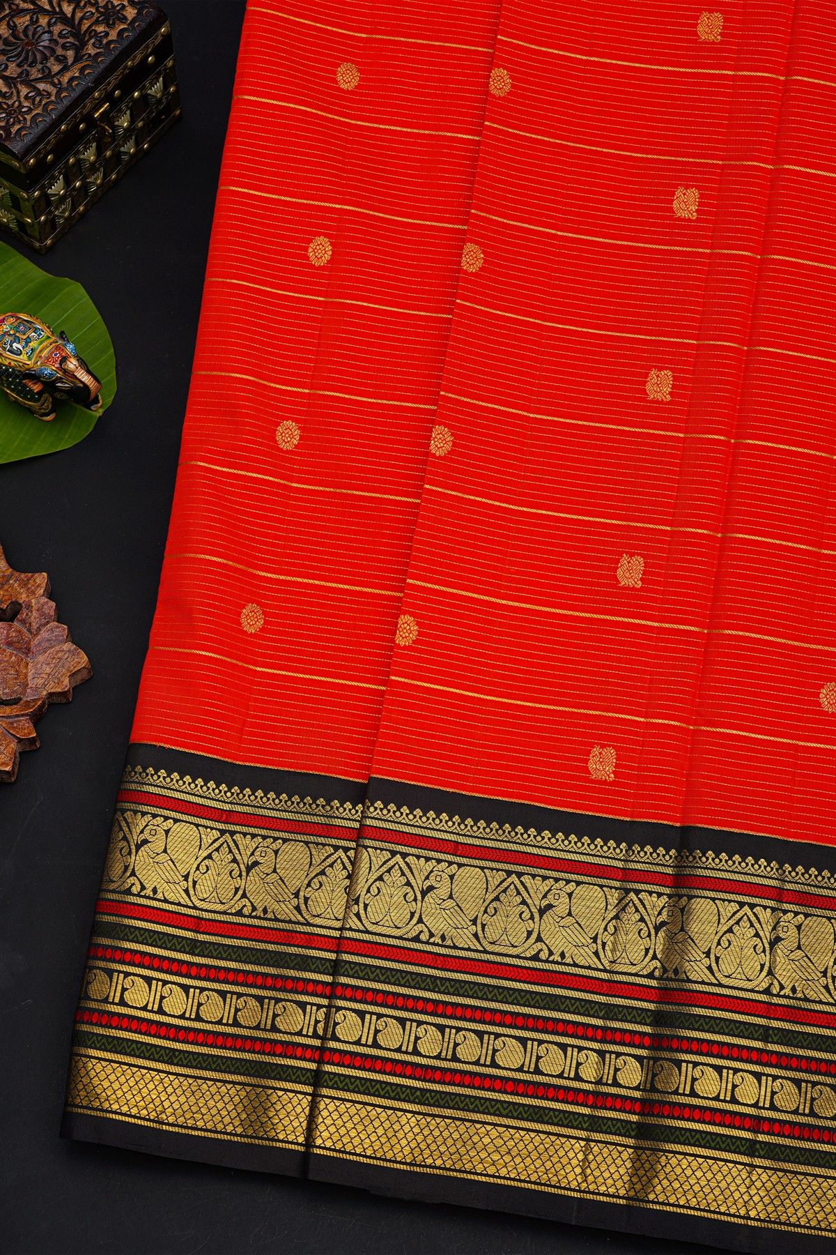 Kancheepuram Silk Orange Saree With Contrast Florals And Peacocks Border