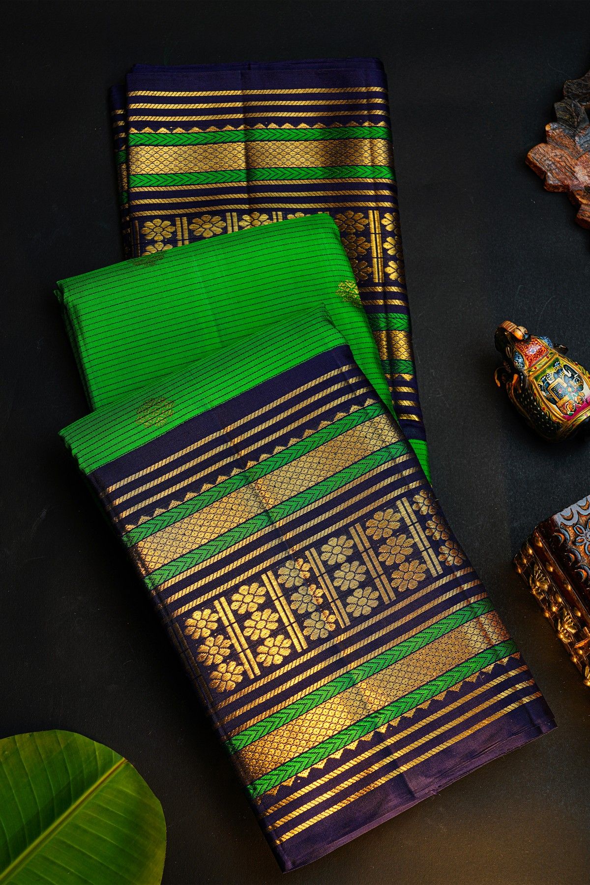 Kancheepuram Silk Parrot Green Saree With Buttis And Zari Lines Body