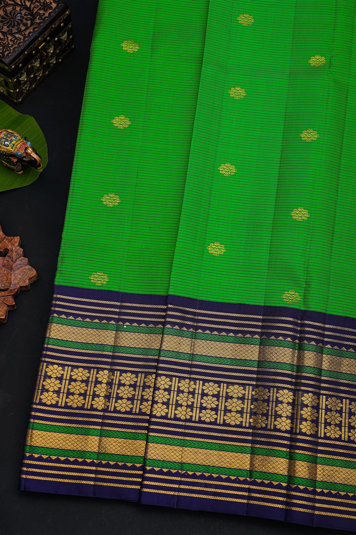 Kancheepuram Silk Parrot Green Saree With Buttis And Zari Lines Body