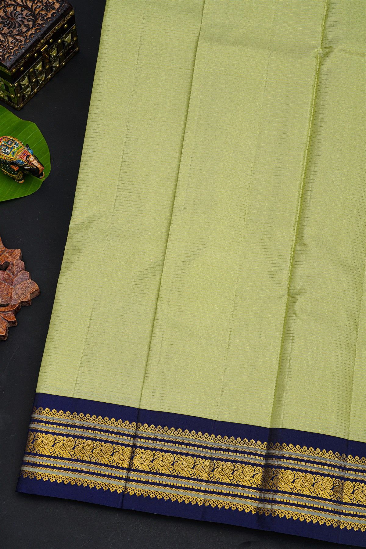 Kancheepuram Silk Lime Green Saree With Contrast Florals And Peacocks Border