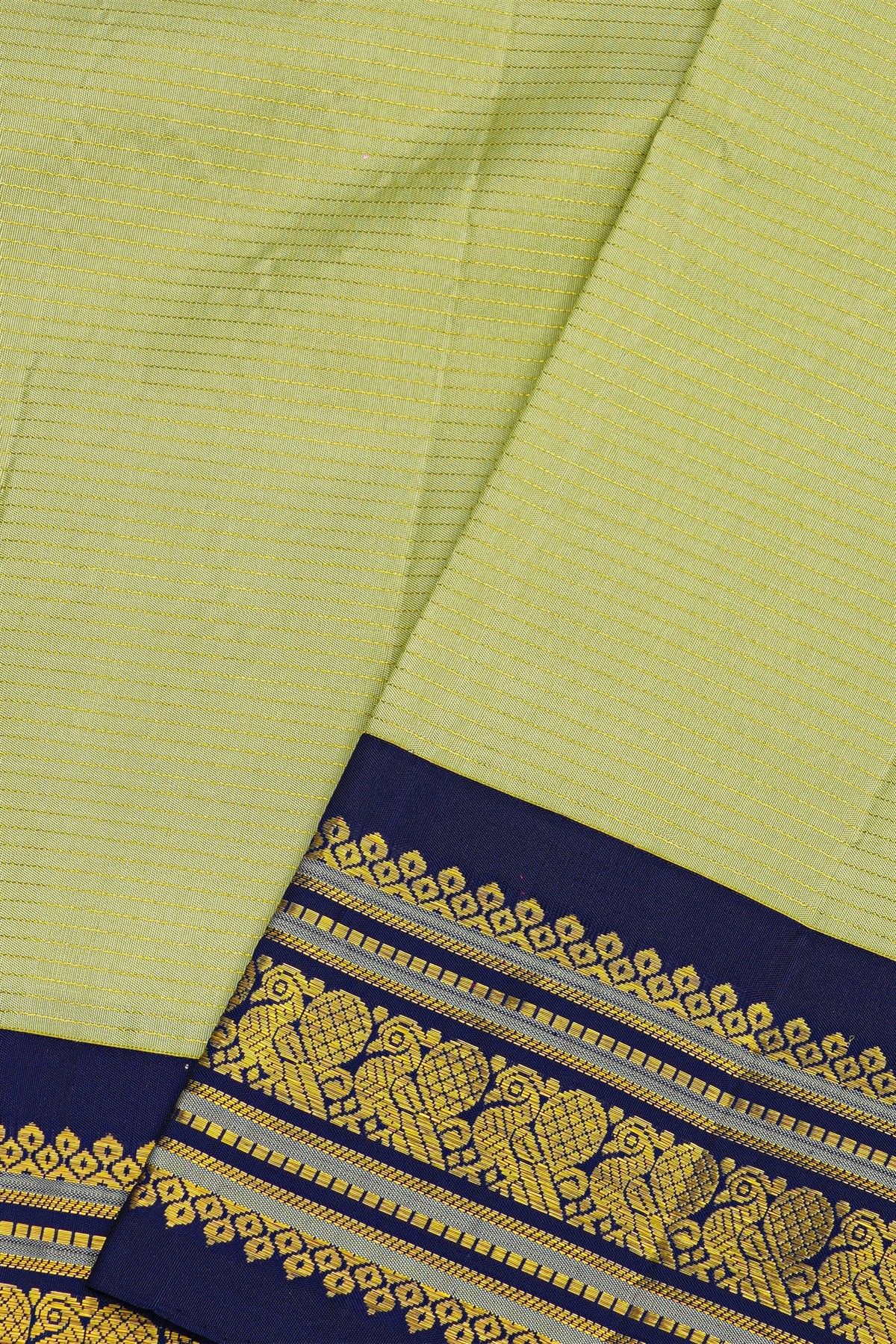 Kancheepuram Silk Lime Green Saree With Contrast Florals And Peacocks Border