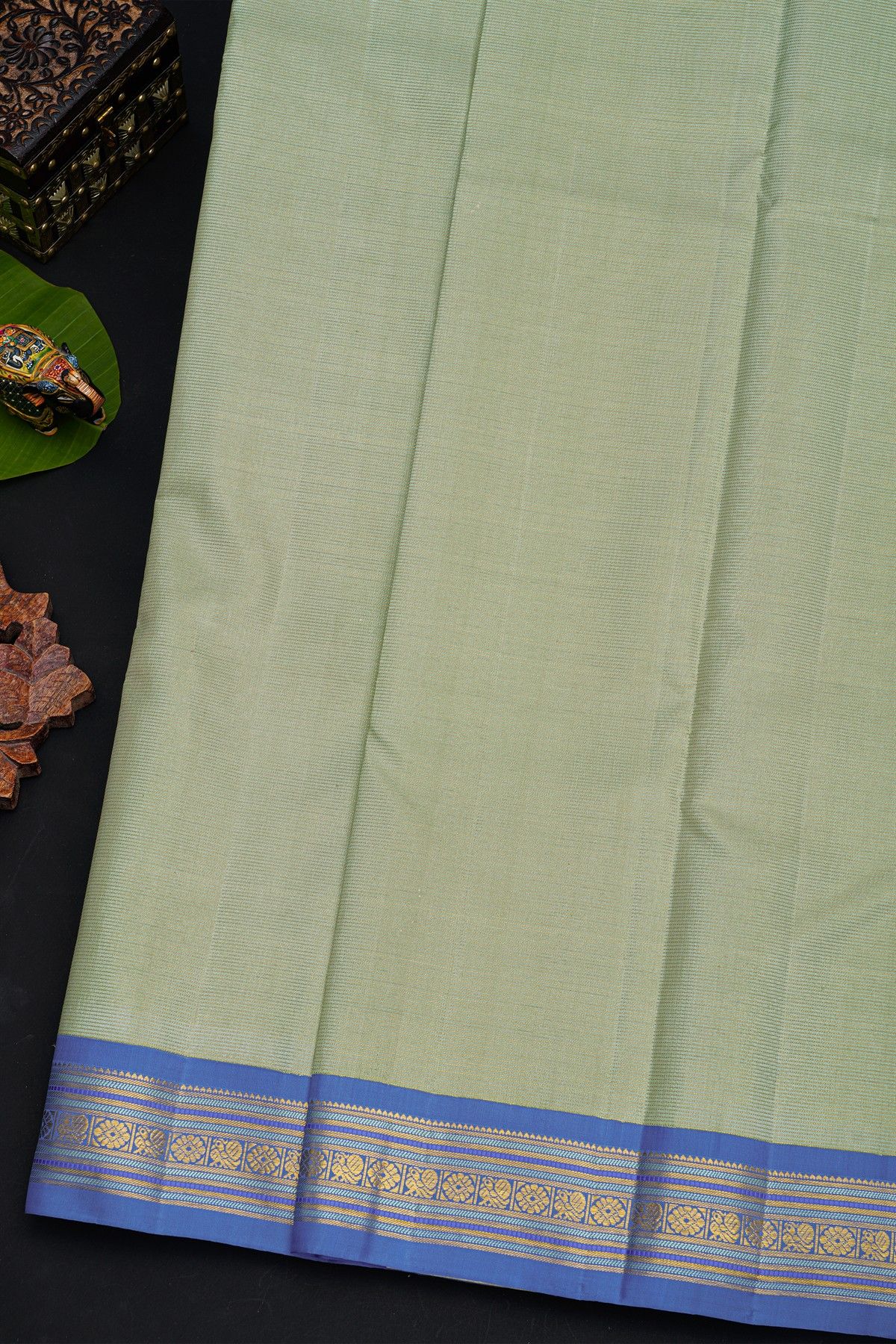 Kancheepuram Silk Pastel Green Saree With Contrast Florals And Peacocks Border