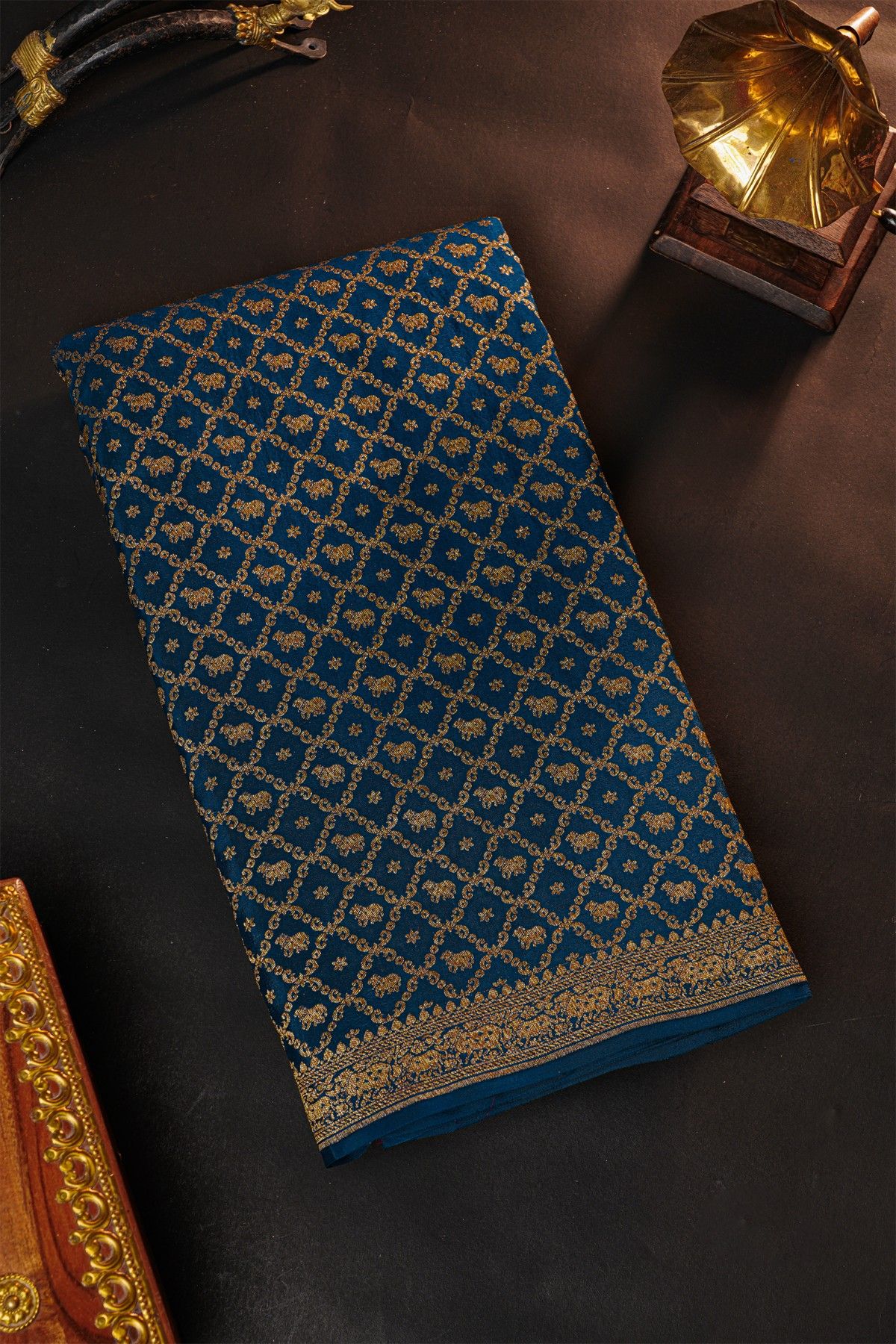 Fancy Georgette Indigo Saree With Diamond Grid Zari Jaal With Elephant Buttis Body And Contrast Florals And Leaves With Animals Border