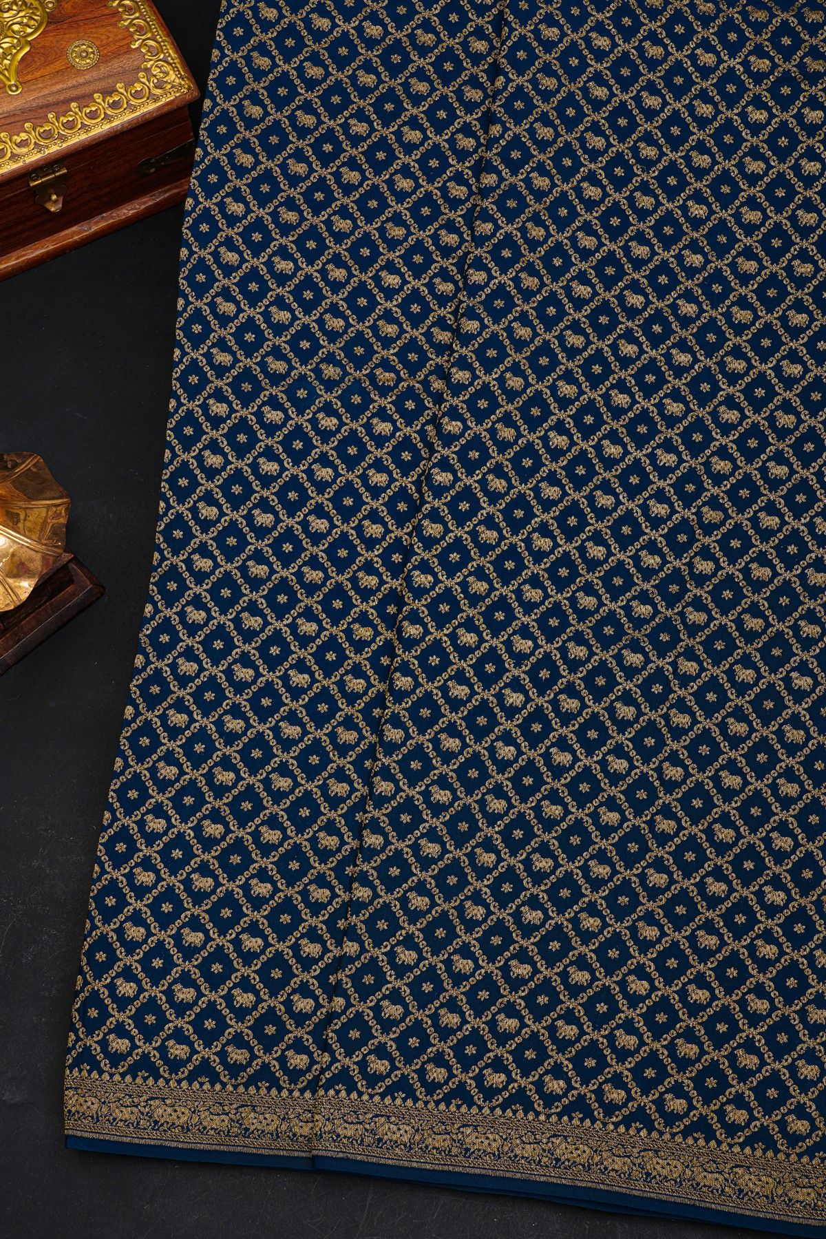 Fancy Georgette Indigo Saree With Diamond Grid Zari Jaal With Elephant Buttis Body And Contrast Florals And Leaves With Animals Border