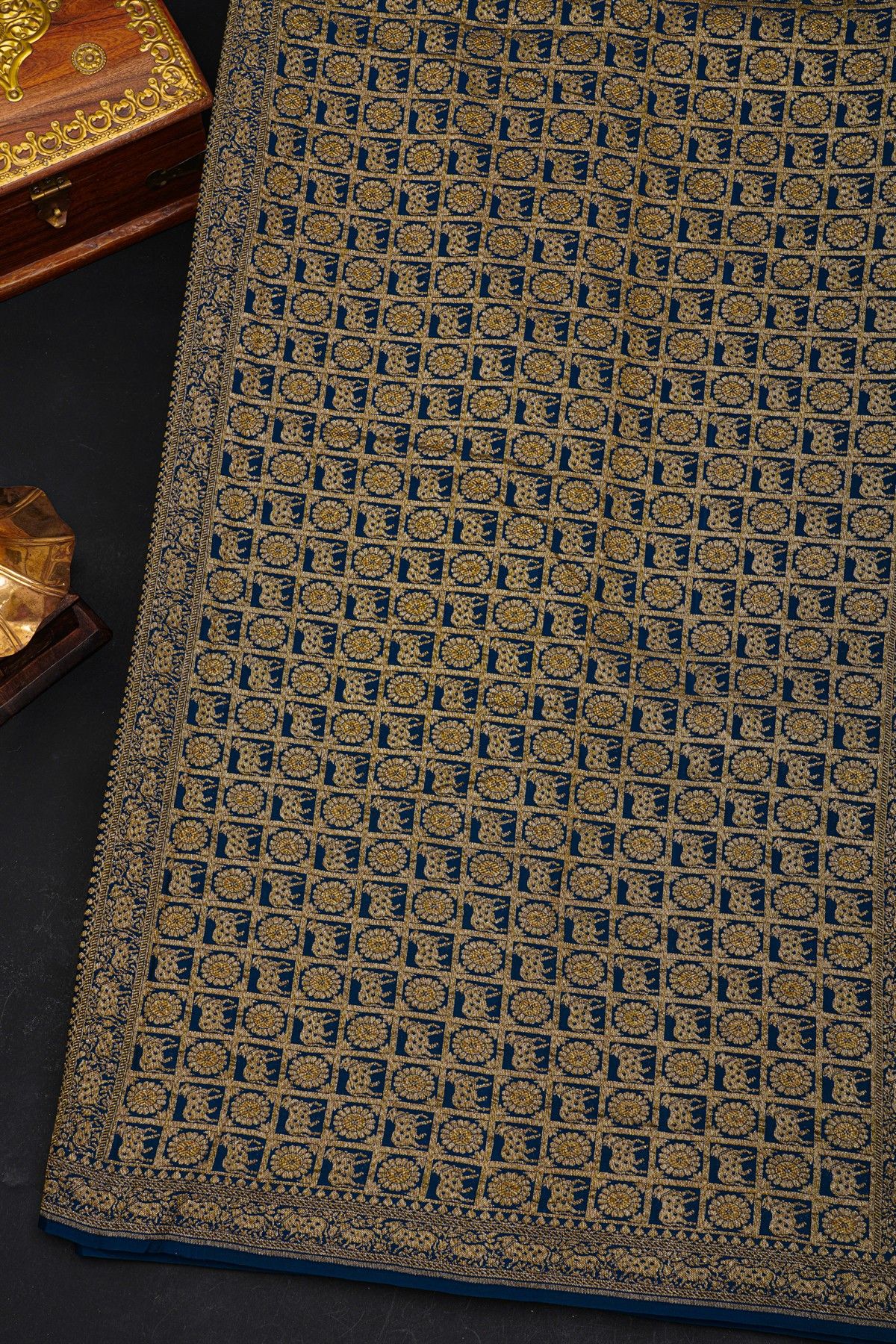 Fancy Georgette Indigo Saree With Diamond Grid Zari Jaal With Elephant Buttis Body And Contrast Florals And Leaves With Animals Border