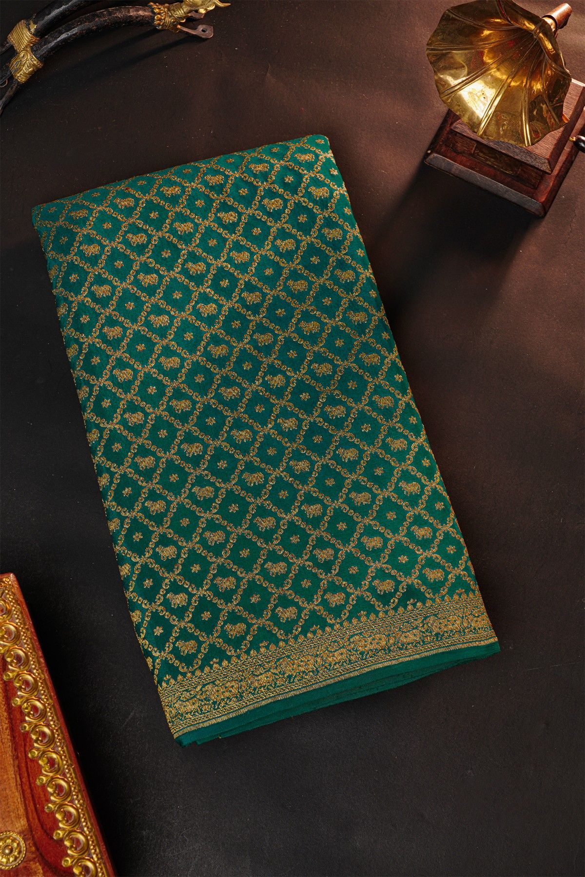 Fancy Georgette Bottle Green Saree With Diamond Grid Zari Jaal And Elephant Buttis Body And Self Florals And Animals Border