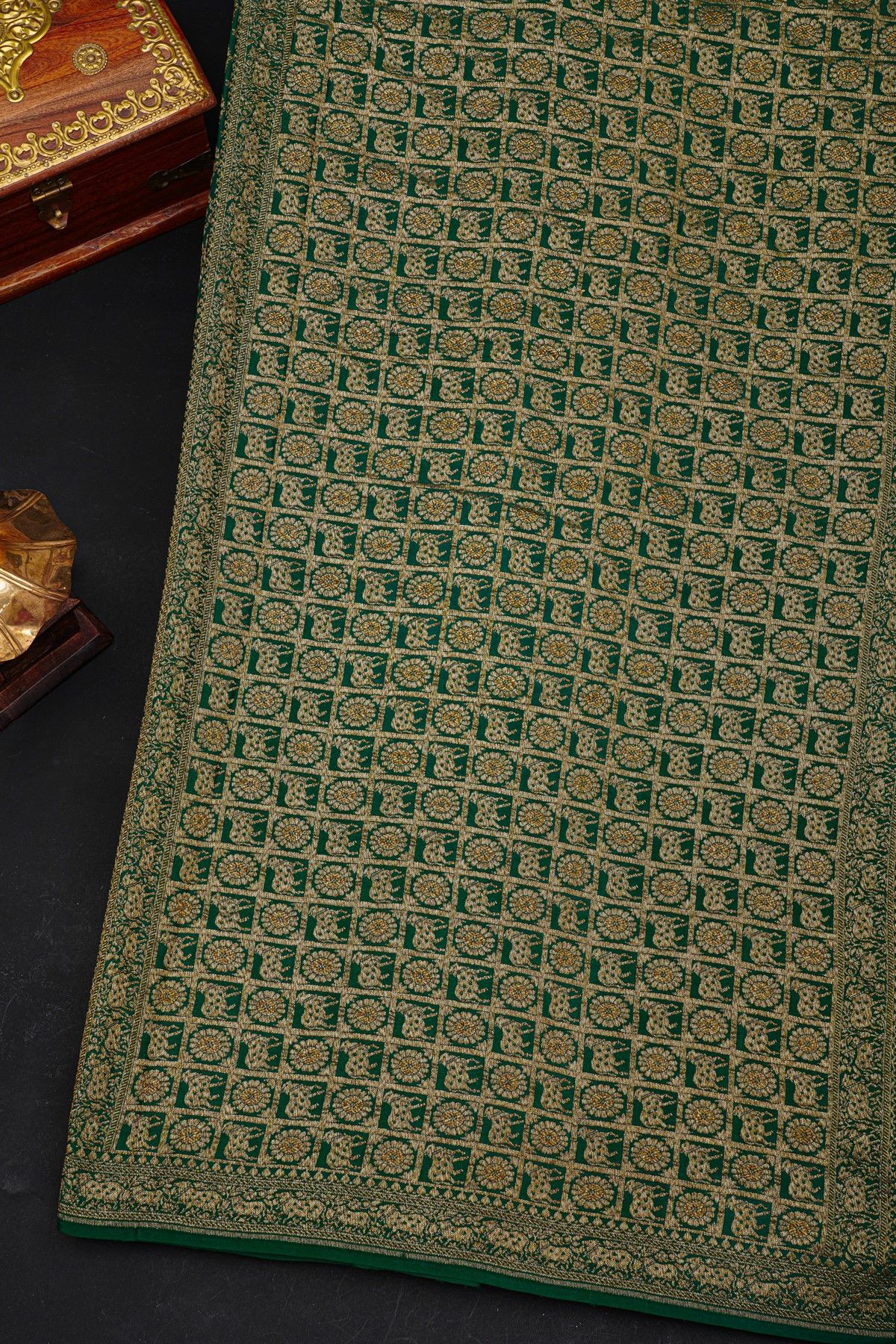 Fancy Georgette Bottle Green Saree With Diamond Grid Zari Jaal And Elephant Buttis Body And Self Florals And Animals Border