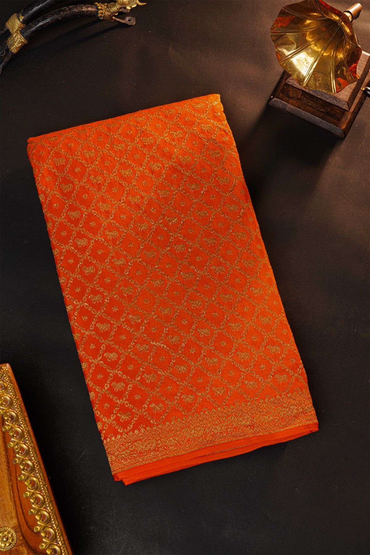 Fancy Georgette Orange Saree With Diamond Grid Zari Jaal And Elephant Buttis Body And Self Florals And Animals Border