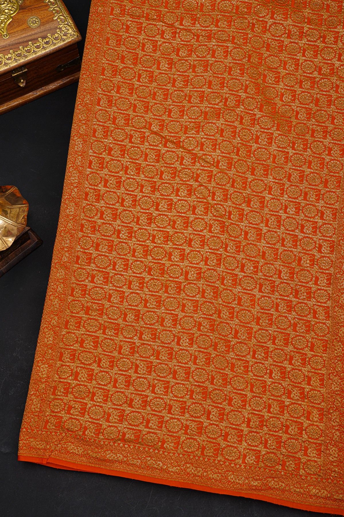 Fancy Georgette Orange Saree With Diamond Grid Zari Jaal And Elephant Buttis Body And Self Florals And Animals Border