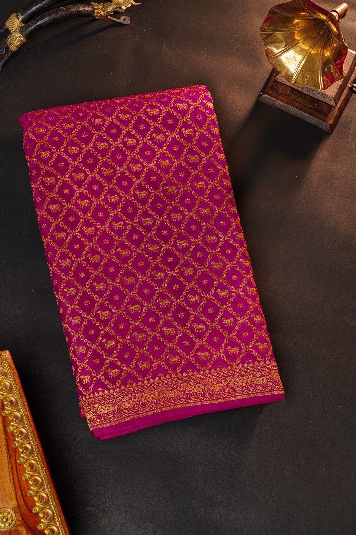 Fancy Georgette Rani Pink Saree With Diamond Grid Zari Jaal And Elephant Buttis Body And Self Florals And Animals Border