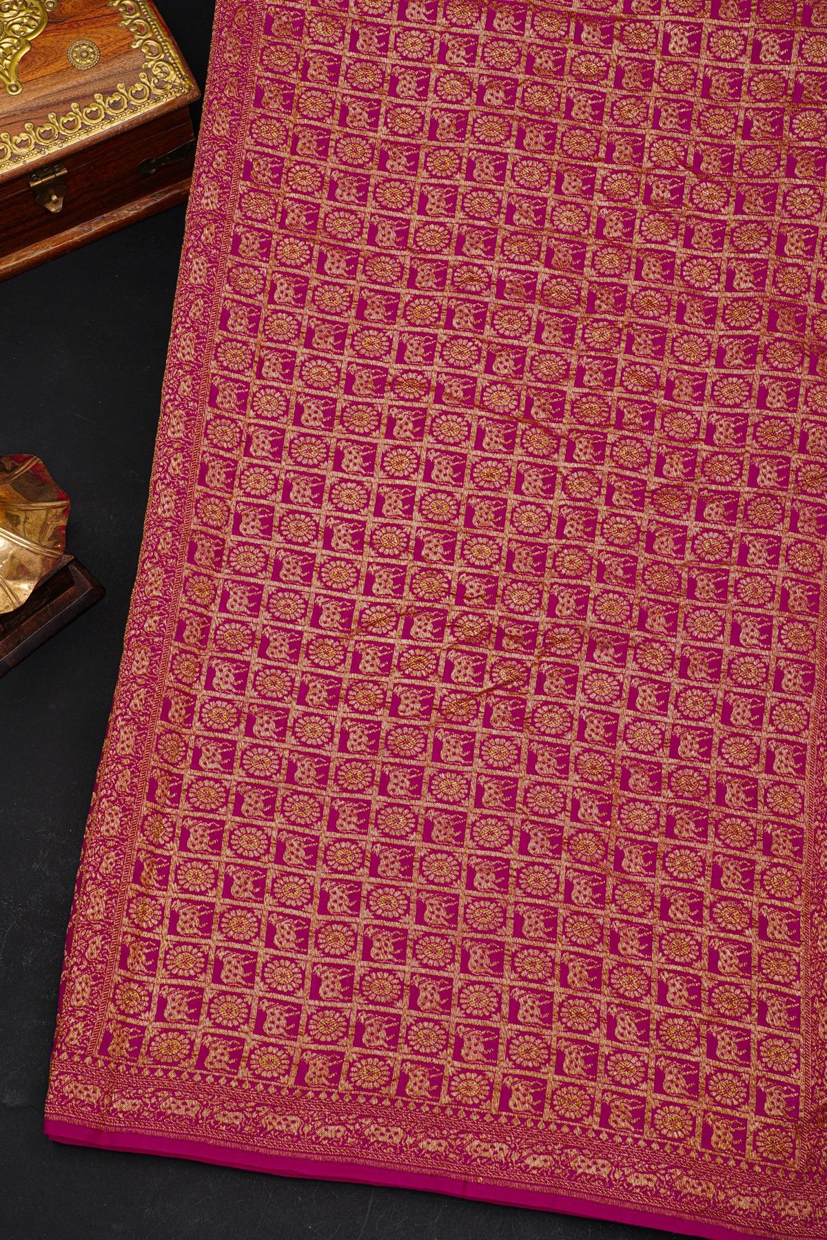 Fancy Georgette Rani Pink Saree With Diamond Grid Zari Jaal And Elephant Buttis Body And Self Florals And Animals Border