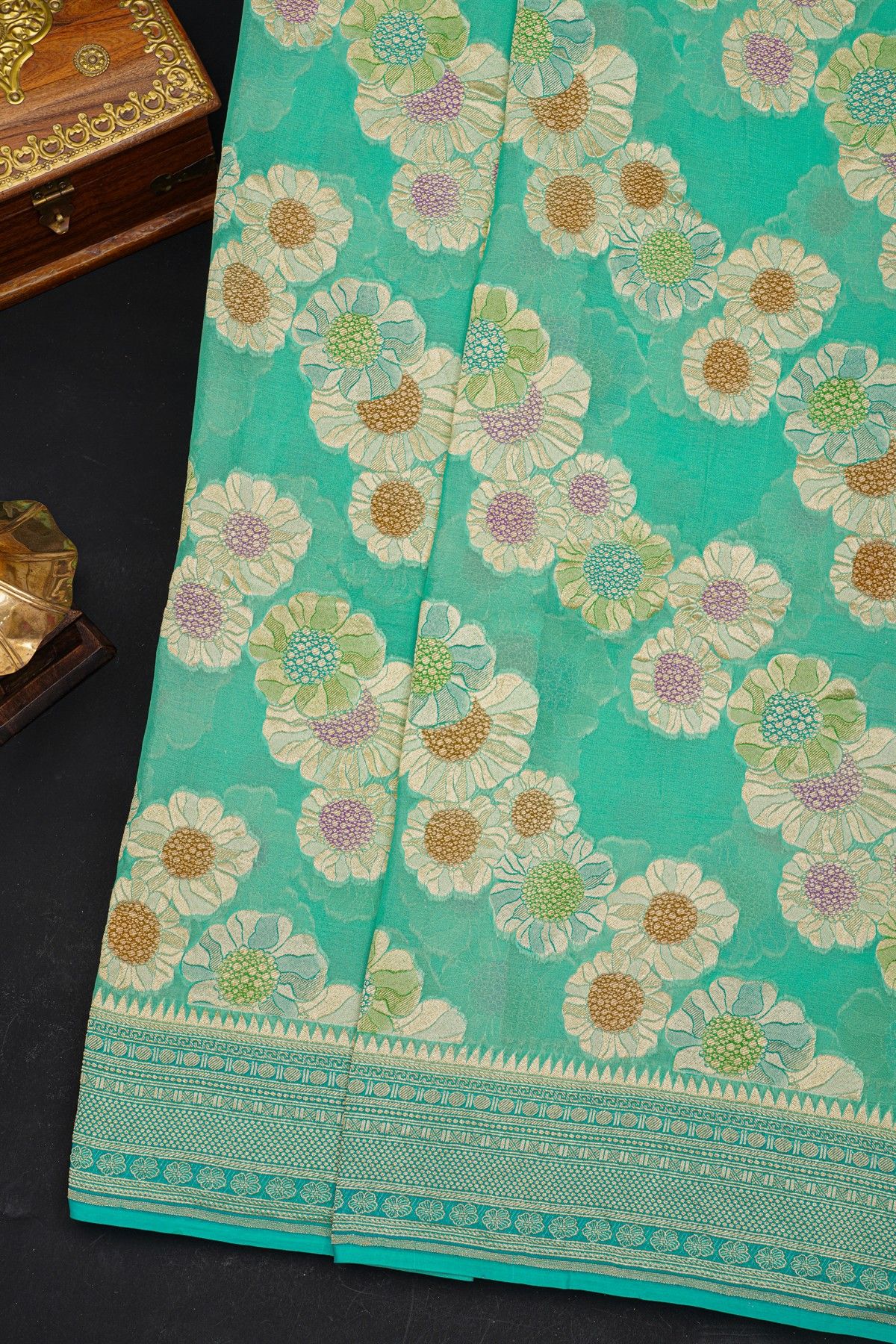 Fancy Georgette Sea Green Saree With Diamond Grid Zari Jaal, Elephant Buttis, Florals And Leaves Body And Self Florals And Animals Border