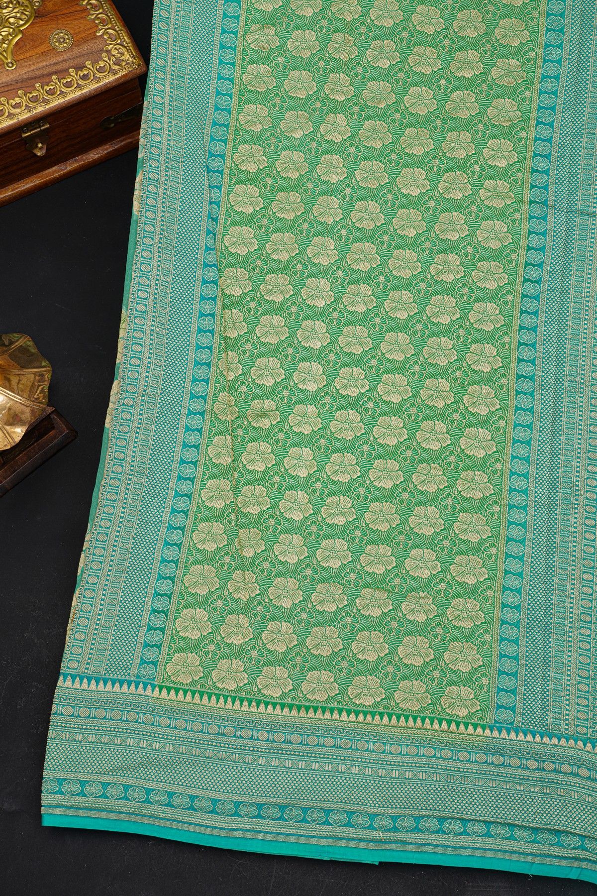 Fancy Georgette Sea Green Saree With Diamond Grid Zari Jaal, Elephant Buttis, Florals And Leaves Body And Self Florals And Animals Border
