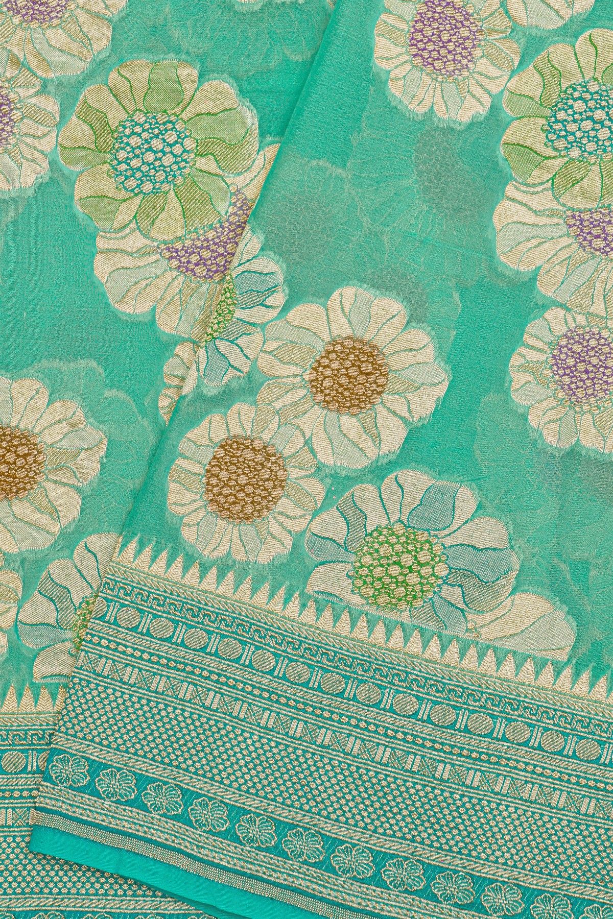 Fancy Georgette Sea Green Saree With Diamond Grid Zari Jaal, Elephant Buttis, Florals And Leaves Body And Self Florals And Animals Border