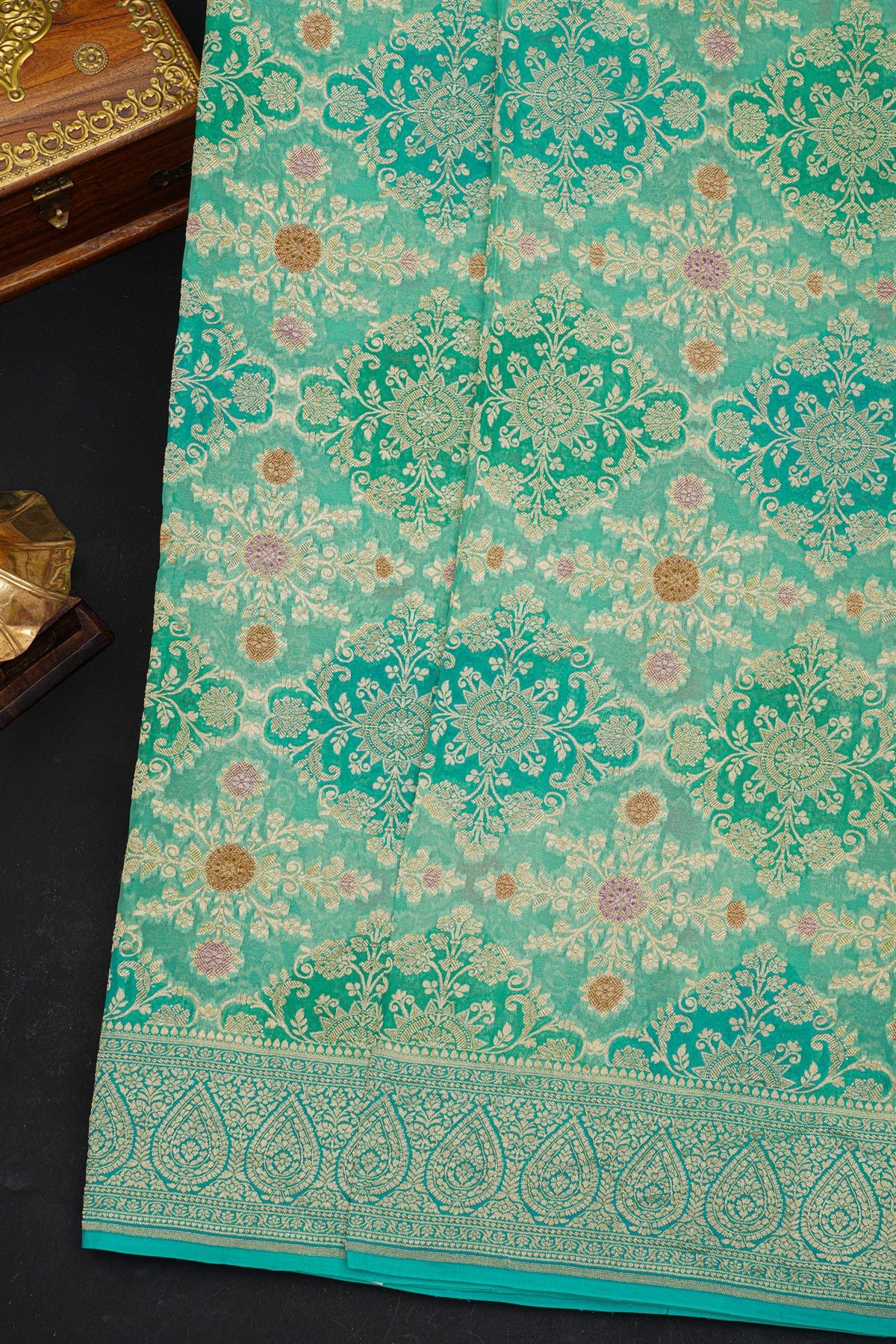 Fancy Georgette Sea Green Saree With All Over Florals In Meenakari Design Body