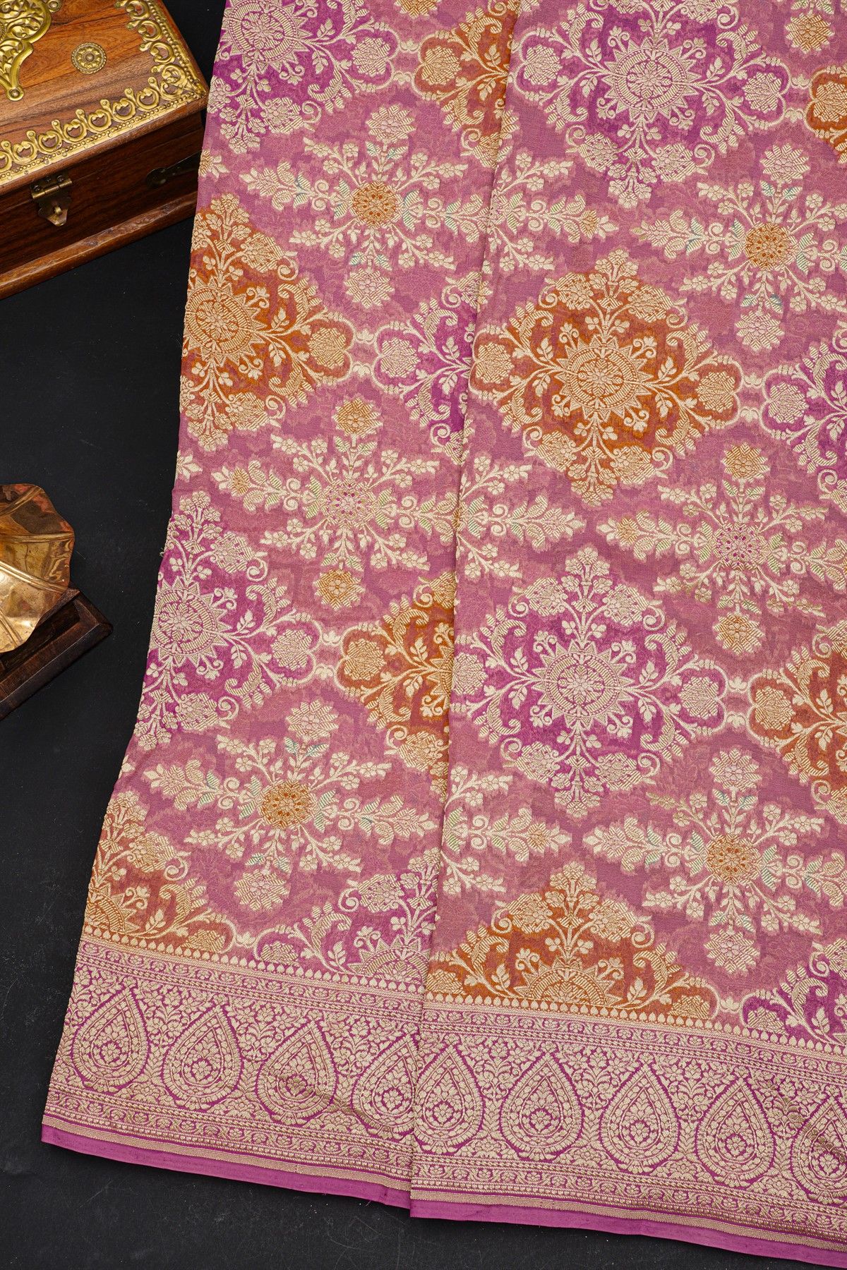 Fancy Georgette Peach Saree With Florals And Leaves Body And Self Florals And Leaves Jaal Border