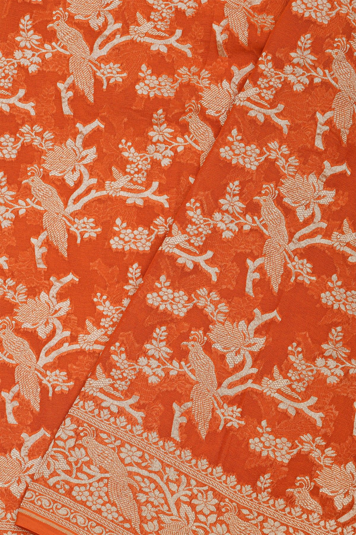 Banarasi Kaddi Georgette Orange Saree With Florals And Peacocks In Zari Body