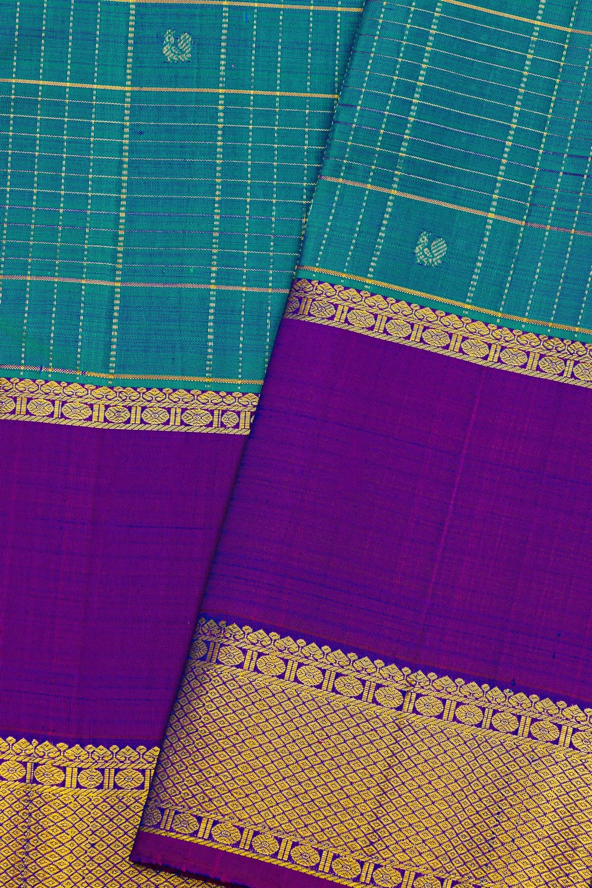Kancheepuram Silk Blue Saree With Florals And Peacocks In Zari Checks