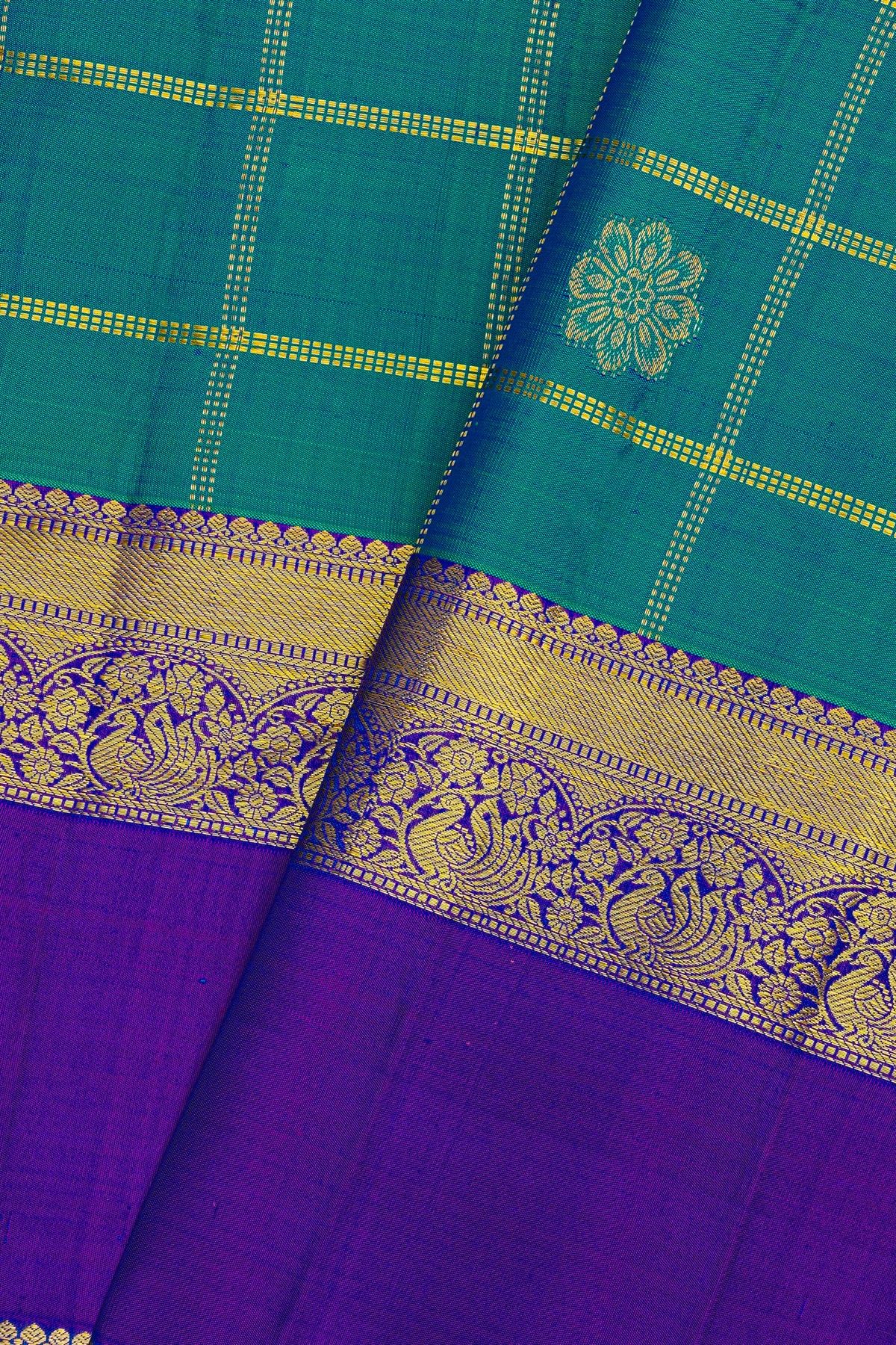 Kancheepuram Silk Peacock Blue Saree With Florals In Zari Checks Body Gap Border