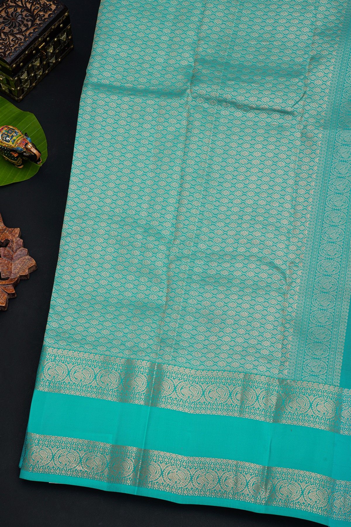 Kancheepuram Silk Wine Saree With Florals And Leaves In Zari Body Gap Border