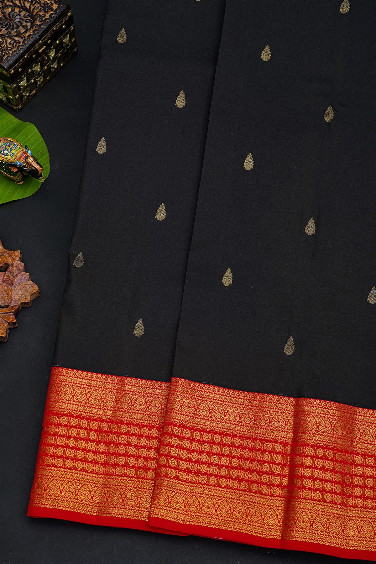 Kancheepuram Silk Black Saree With Florals And Leaves In Zari