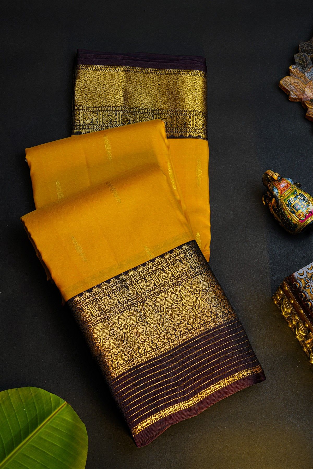 Kancheepuram Silk Yellow Saree With Florals And Leaves In Zari Body Contrast Border