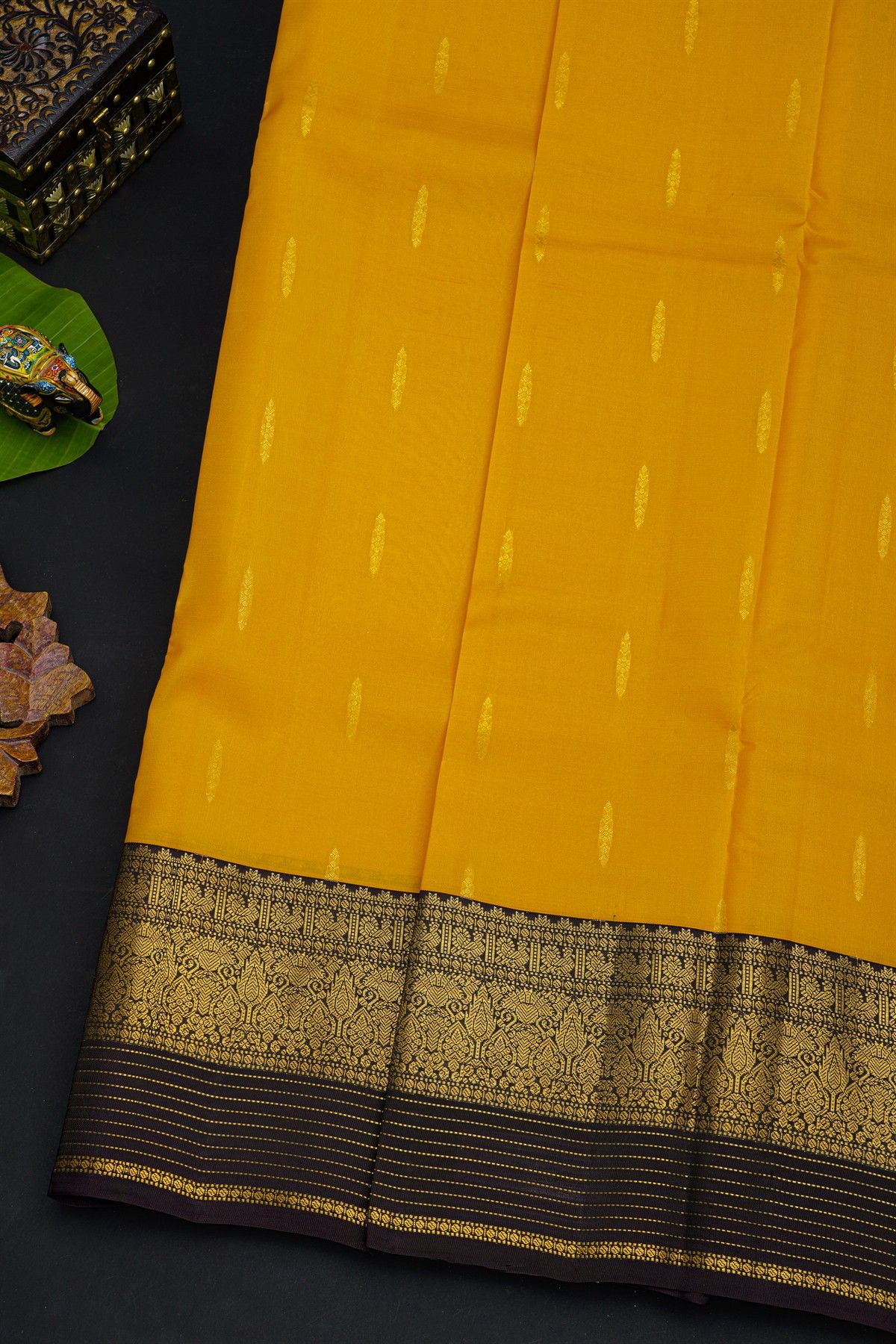 Kancheepuram Silk Yellow Saree With Florals And Leaves In Zari Body Contrast Border